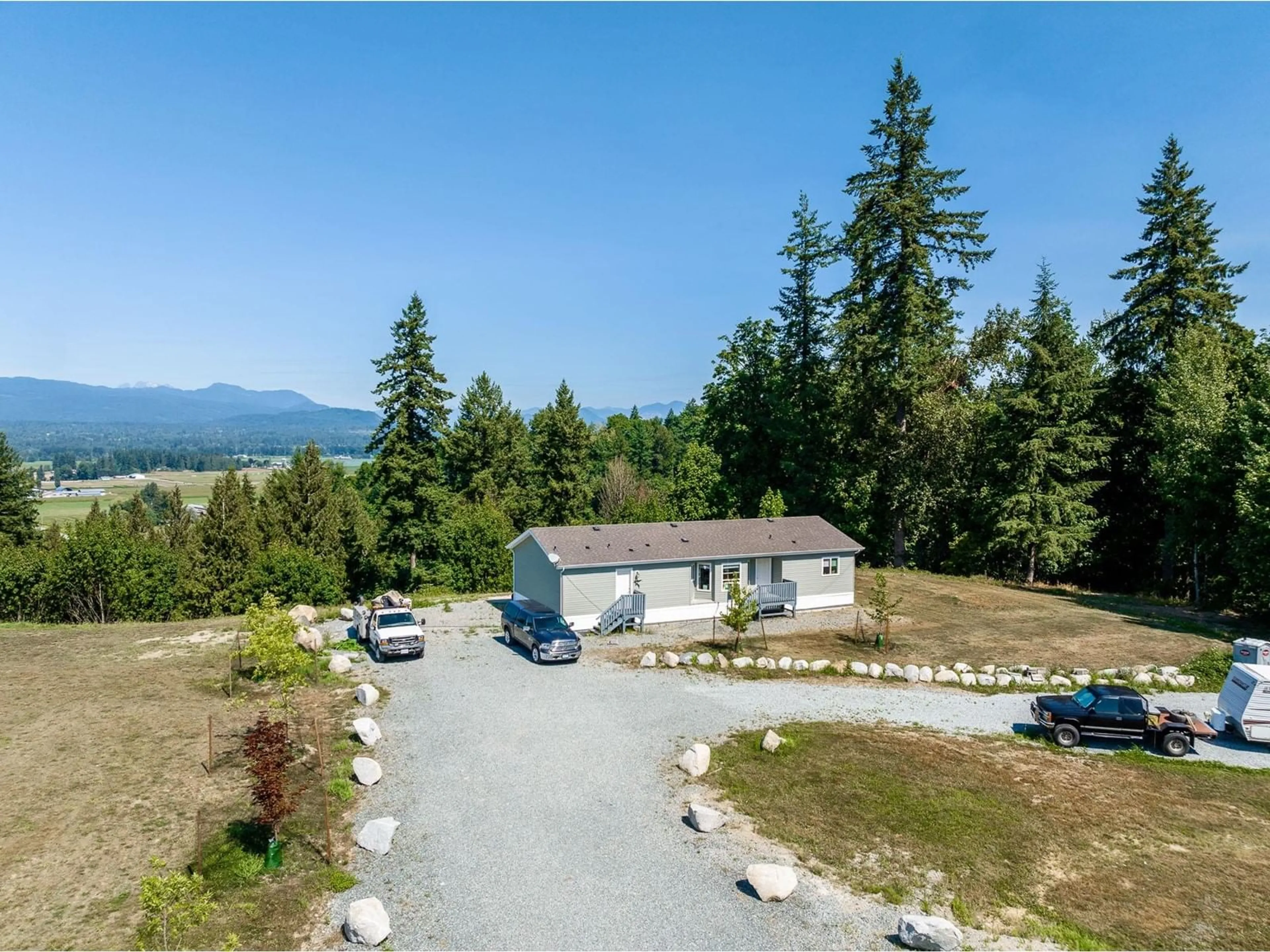A pic from outside/outdoor area/front of a property/back of a property/a pic from drone, mountain view for 7039 272, Langley British Columbia V4W1R3