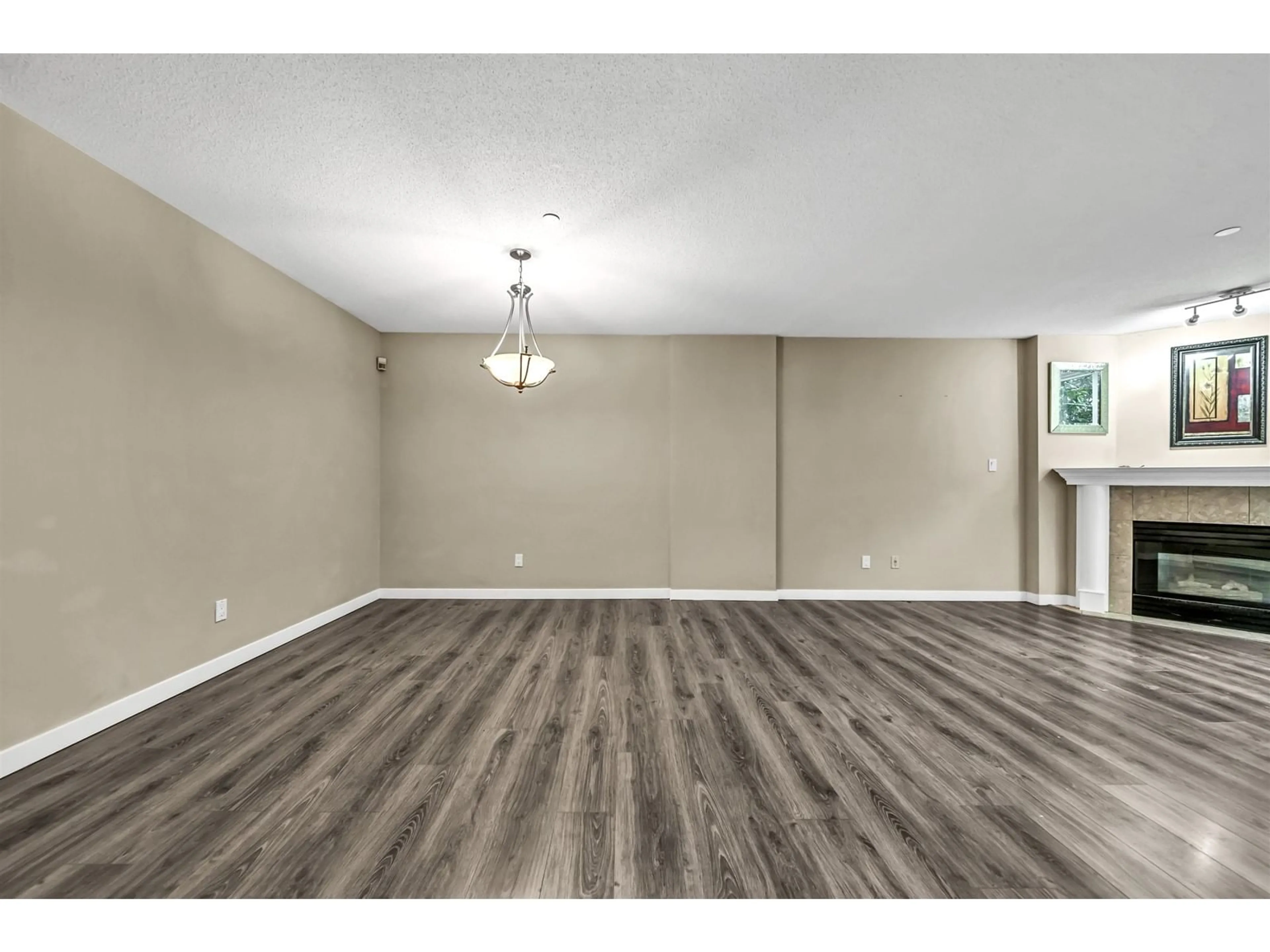 A pic of a room, wood floors for L02 13880 101 AVENUE, Surrey British Columbia V3T5T1