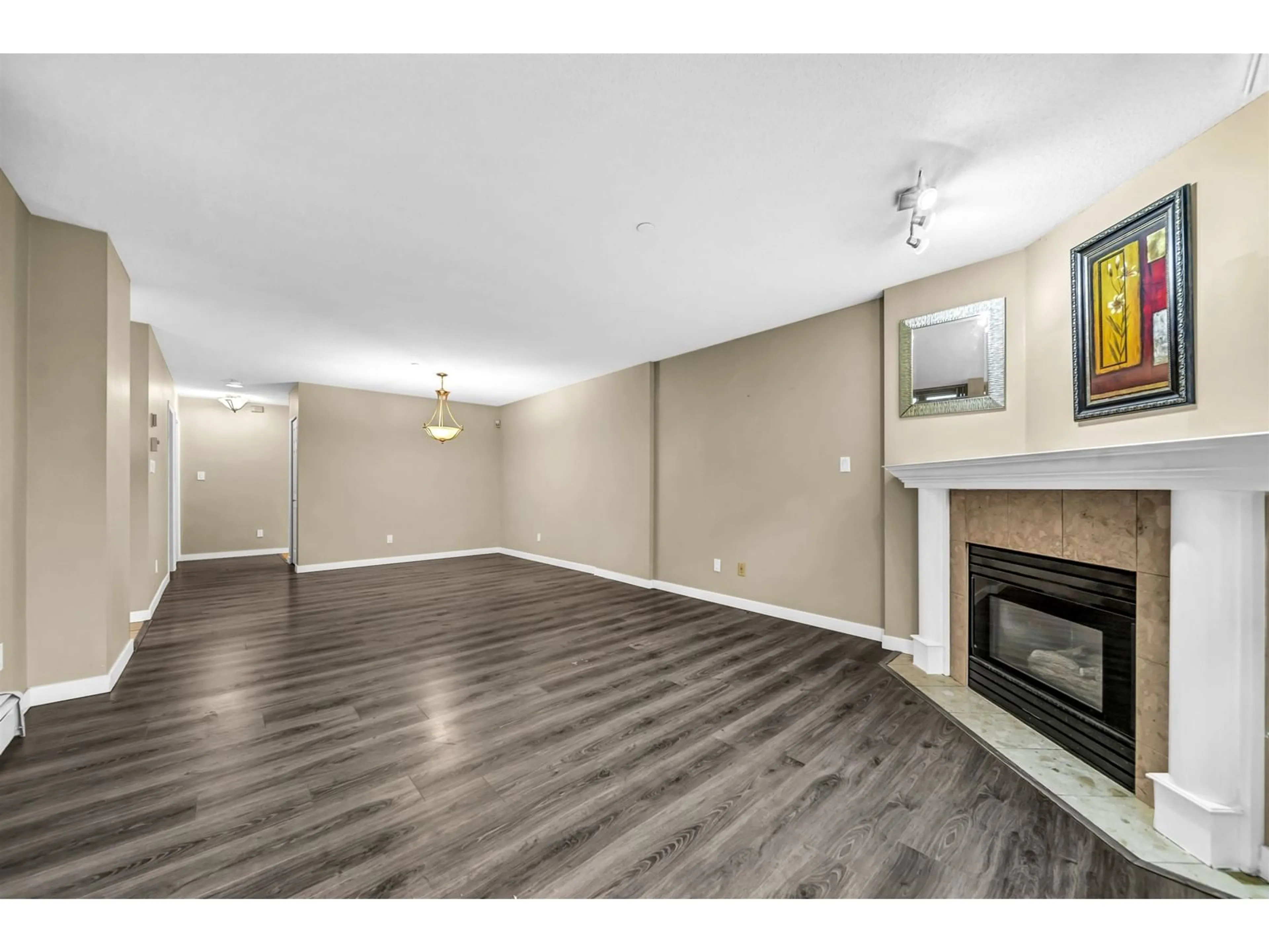 A pic of a room, wood floors for L02 13880 101 AVENUE, Surrey British Columbia V3T5T1