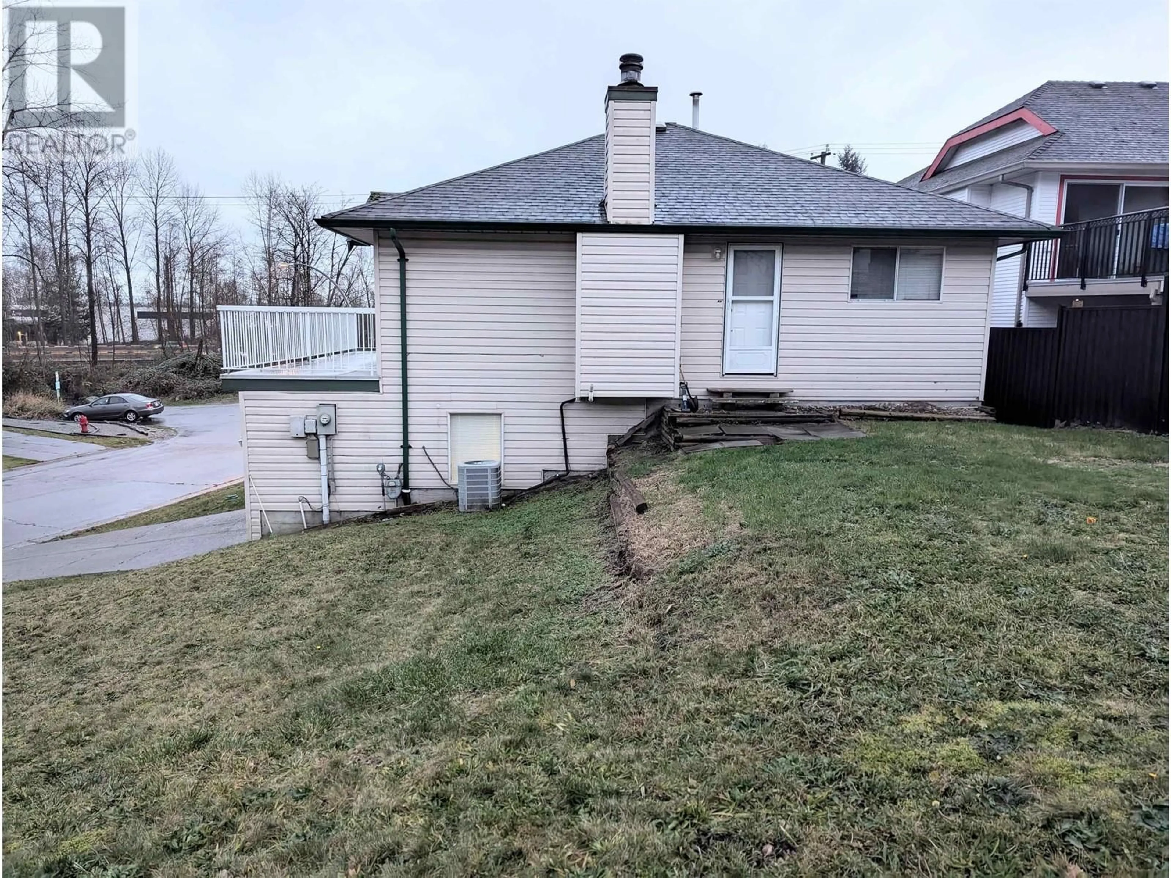 Frontside or backside of a home, the fenced backyard for 1216 BRAND STREET, Port Coquitlam British Columbia V3C5C4