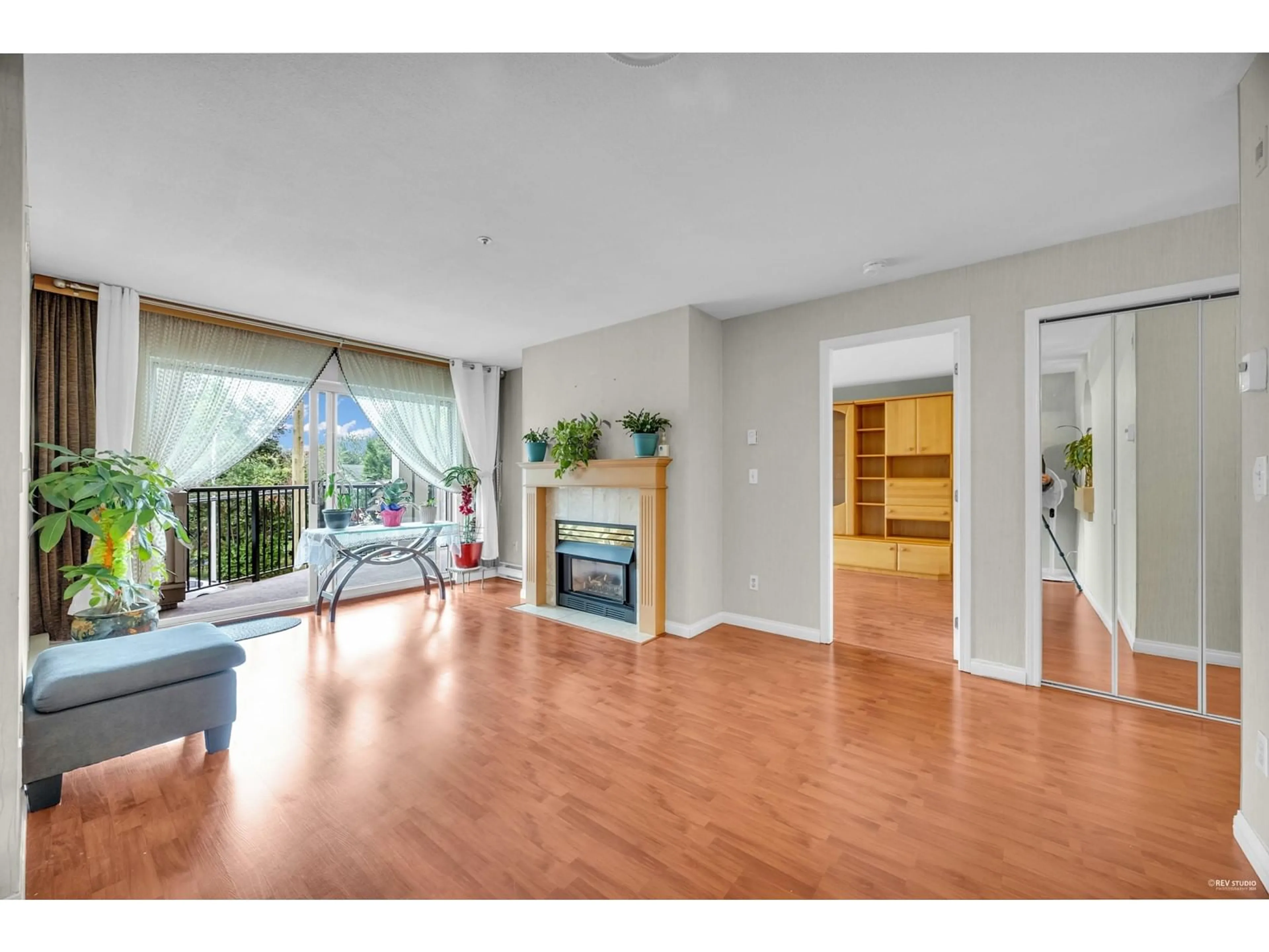 A pic of a room, wood floors for 201 20727 DOUGLAS CRESCENT, Langley British Columbia V3A4C1