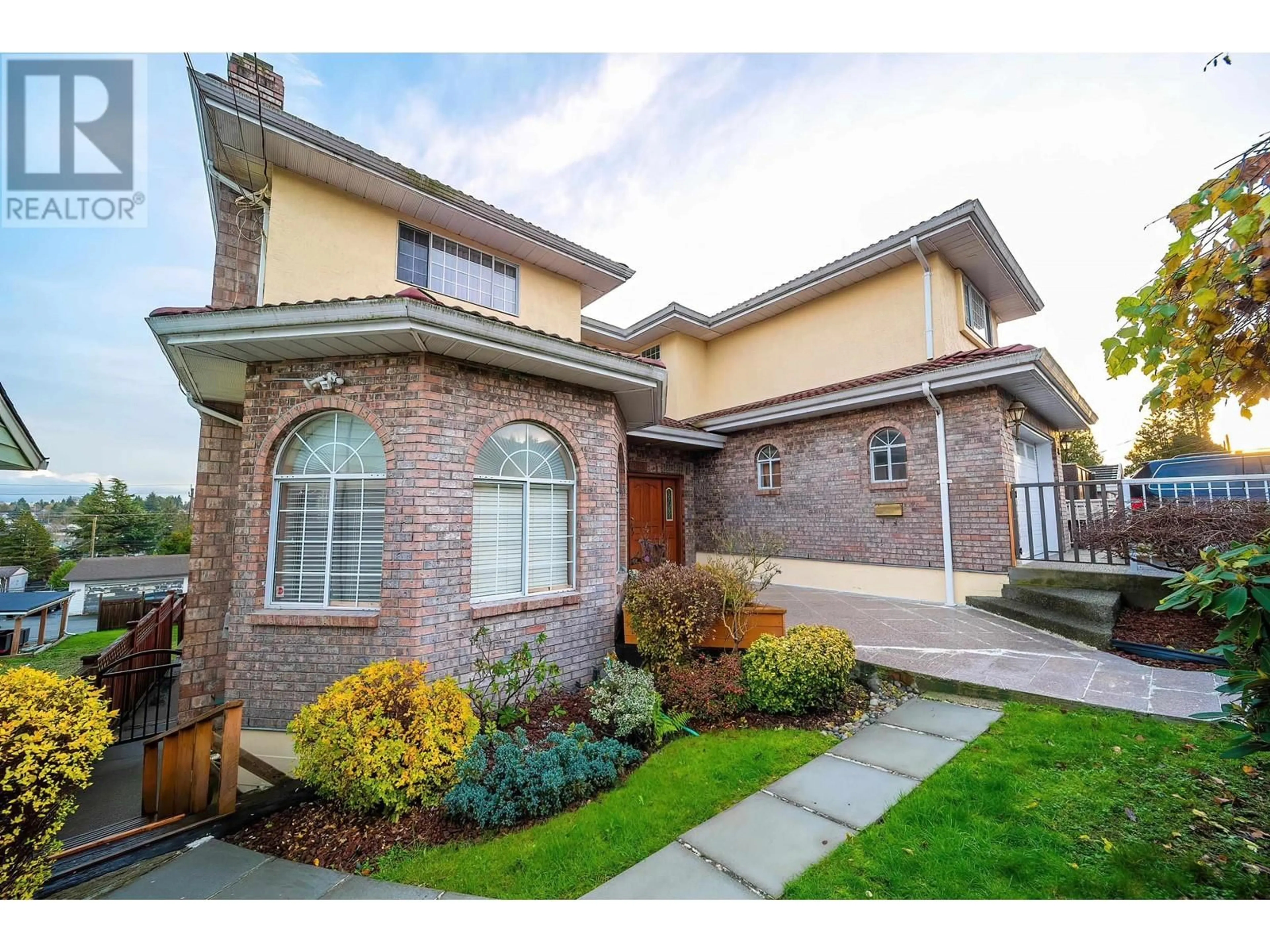 Home with brick exterior material for 8030 11TH AVENUE, Burnaby British Columbia V3N2N7