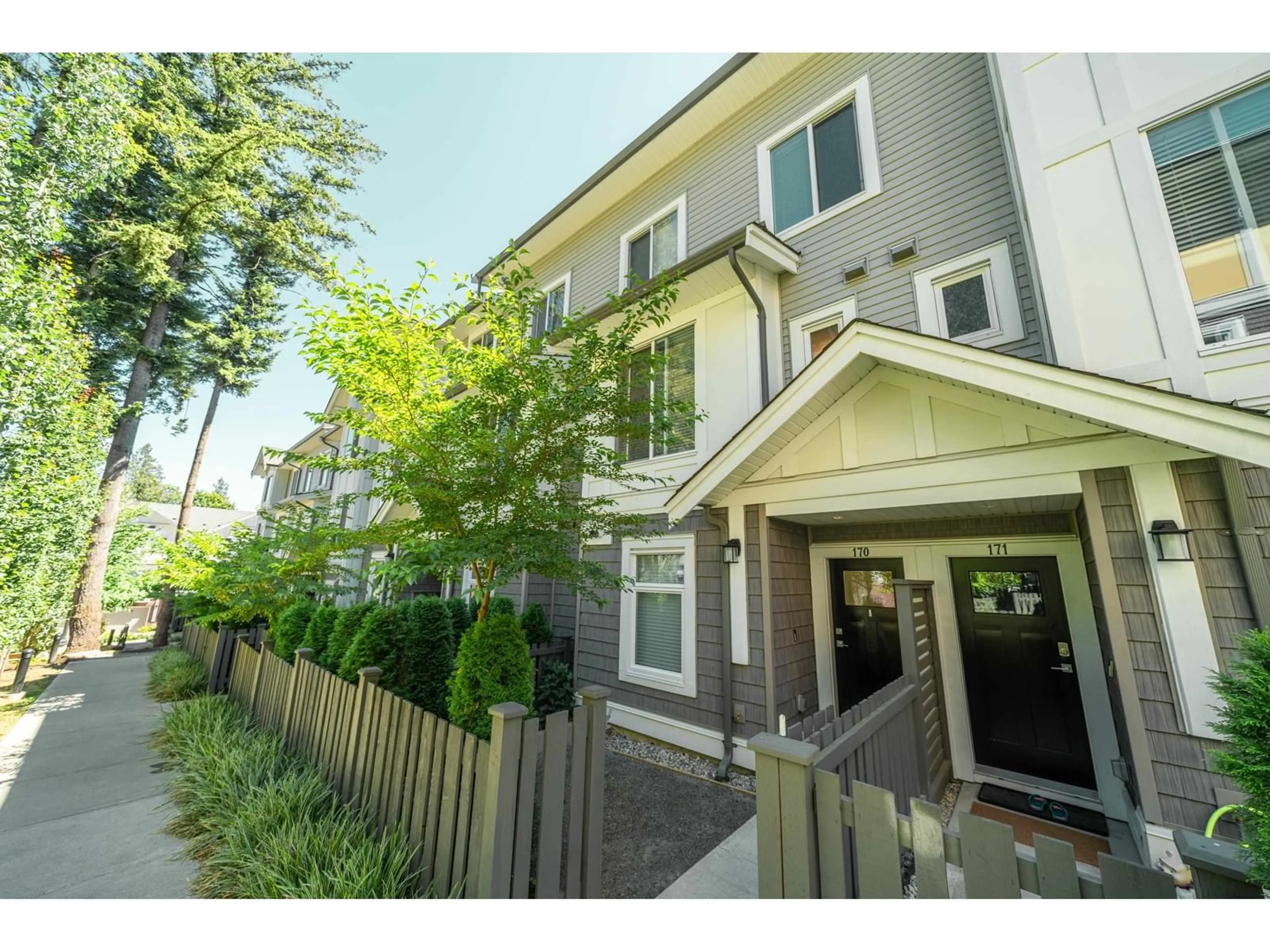 A pic from exterior of the house or condo, the fenced backyard for 170 9718 161A STREET, Surrey British Columbia V4N6S7