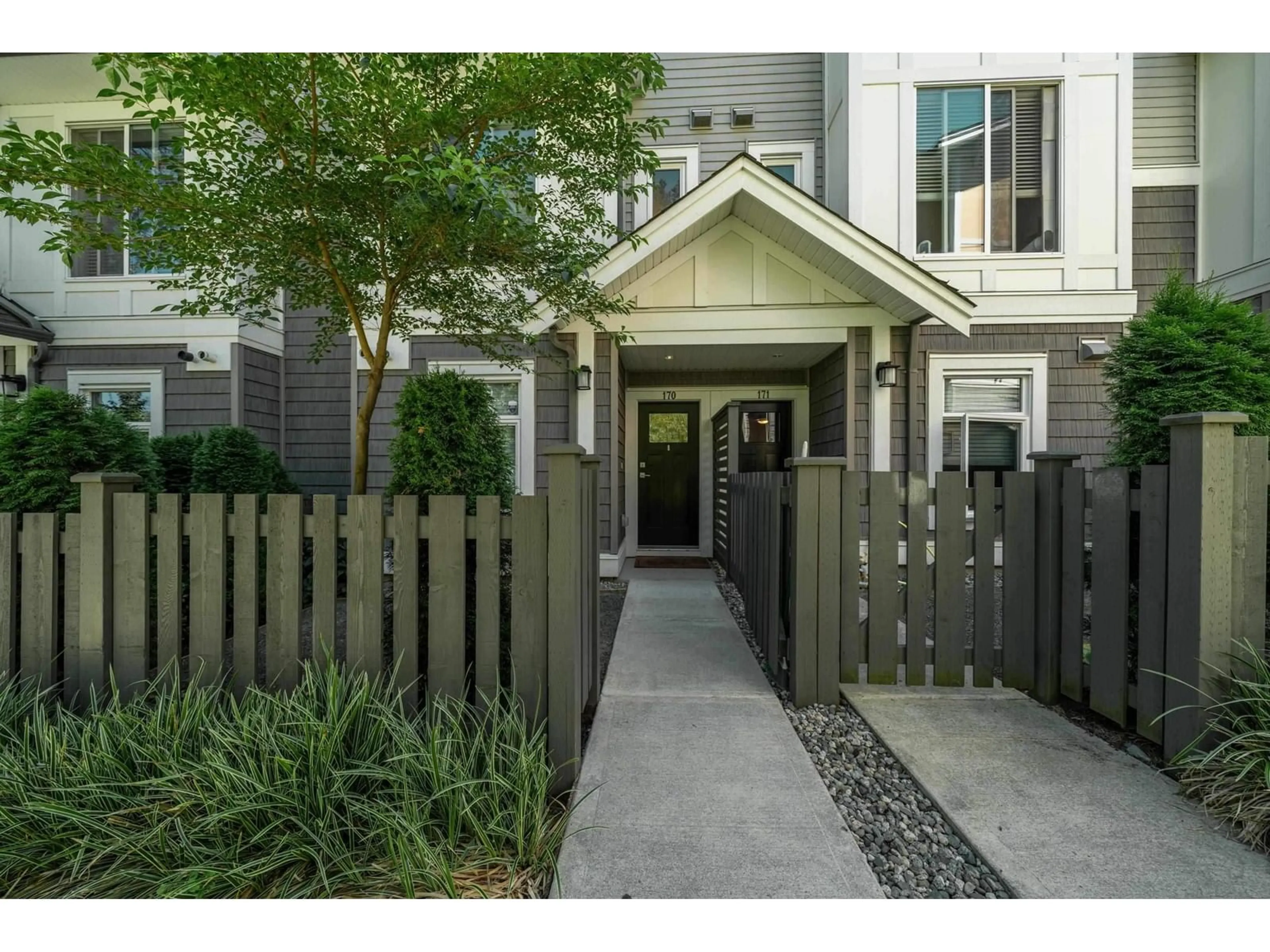 A pic from exterior of the house or condo, the fenced backyard for 170 9718 161A STREET, Surrey British Columbia V4N6S7