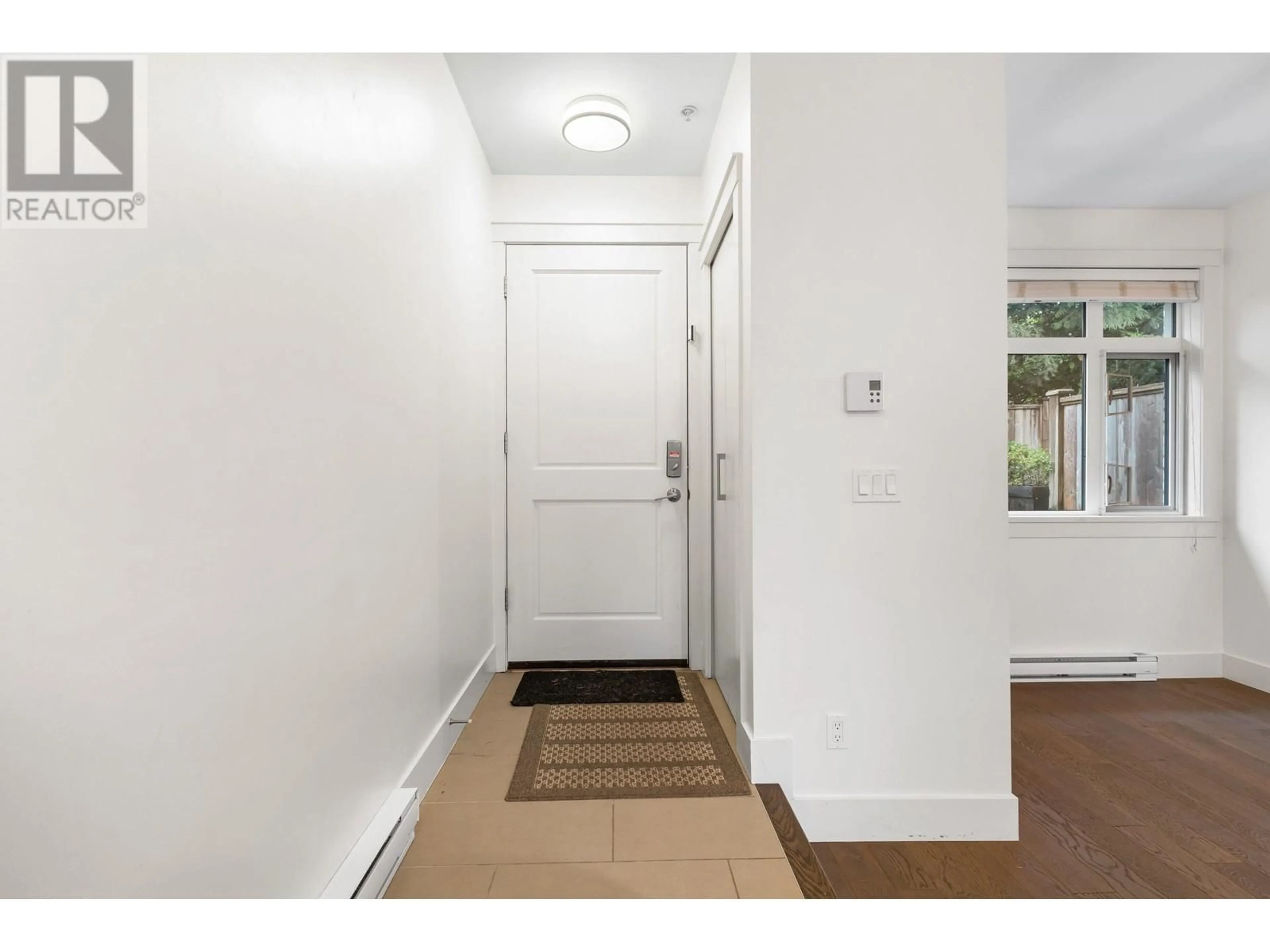 Indoor entryway, wood floors for 5741 ST. GEORGE STREET, Vancouver British Columbia V5W2Y4