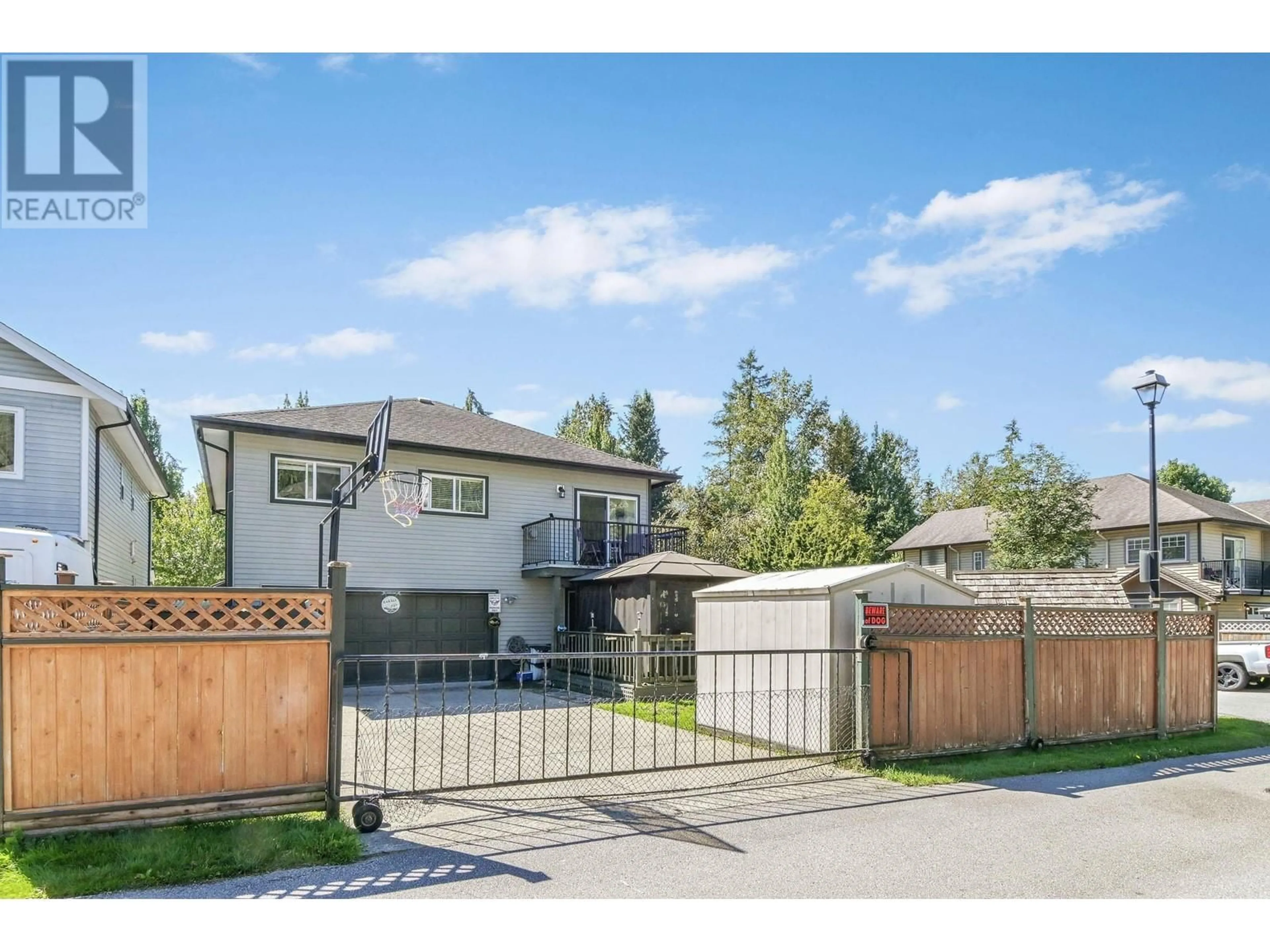 Frontside or backside of a home, the fenced backyard for 23613 KANAKA WAY, Maple Ridge British Columbia V2W2G1