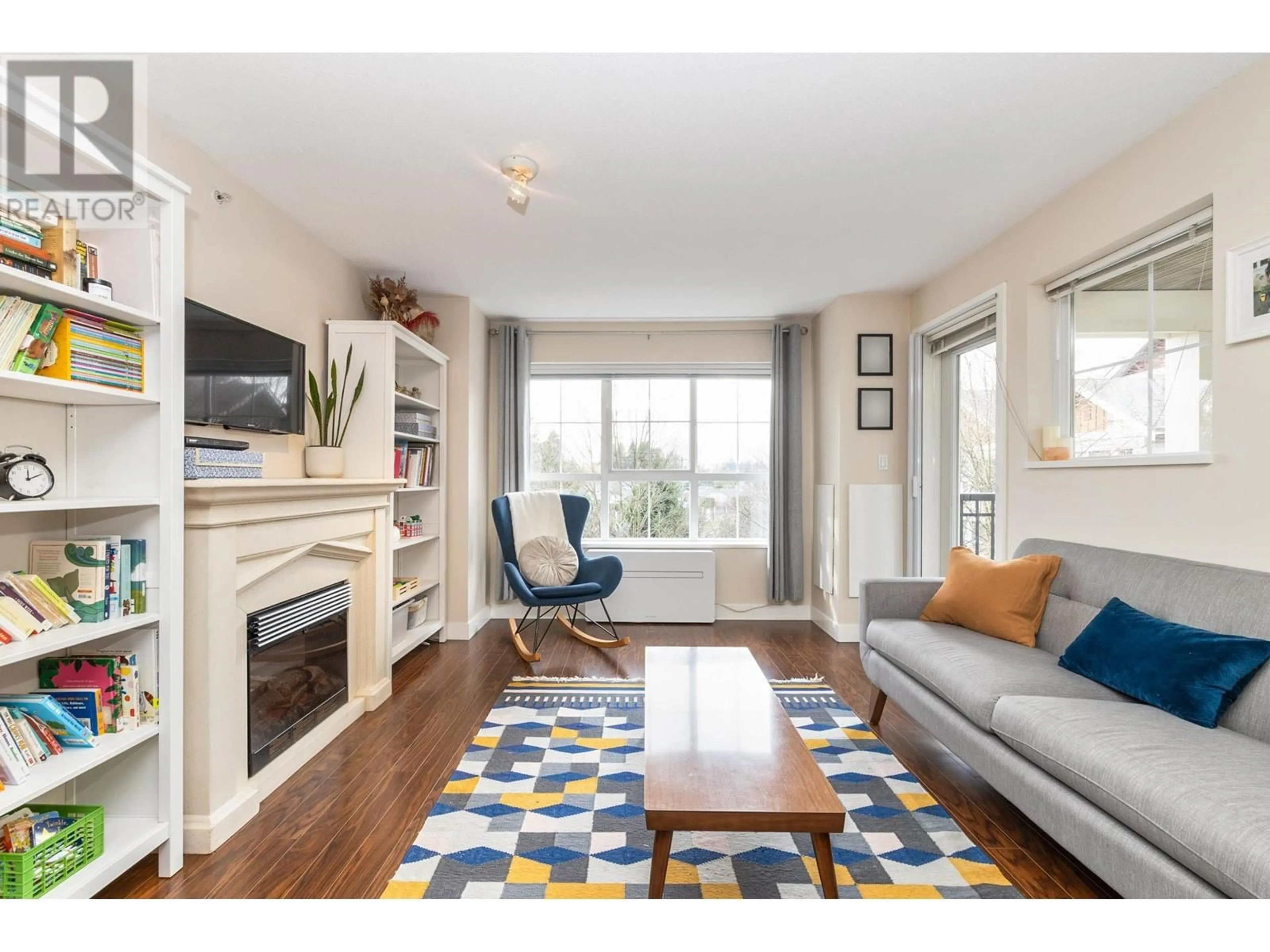 Living room, wood floors for 407 19677 MEADOW GARDENS WAY, Pitt Meadows British Columbia V3Y0A2