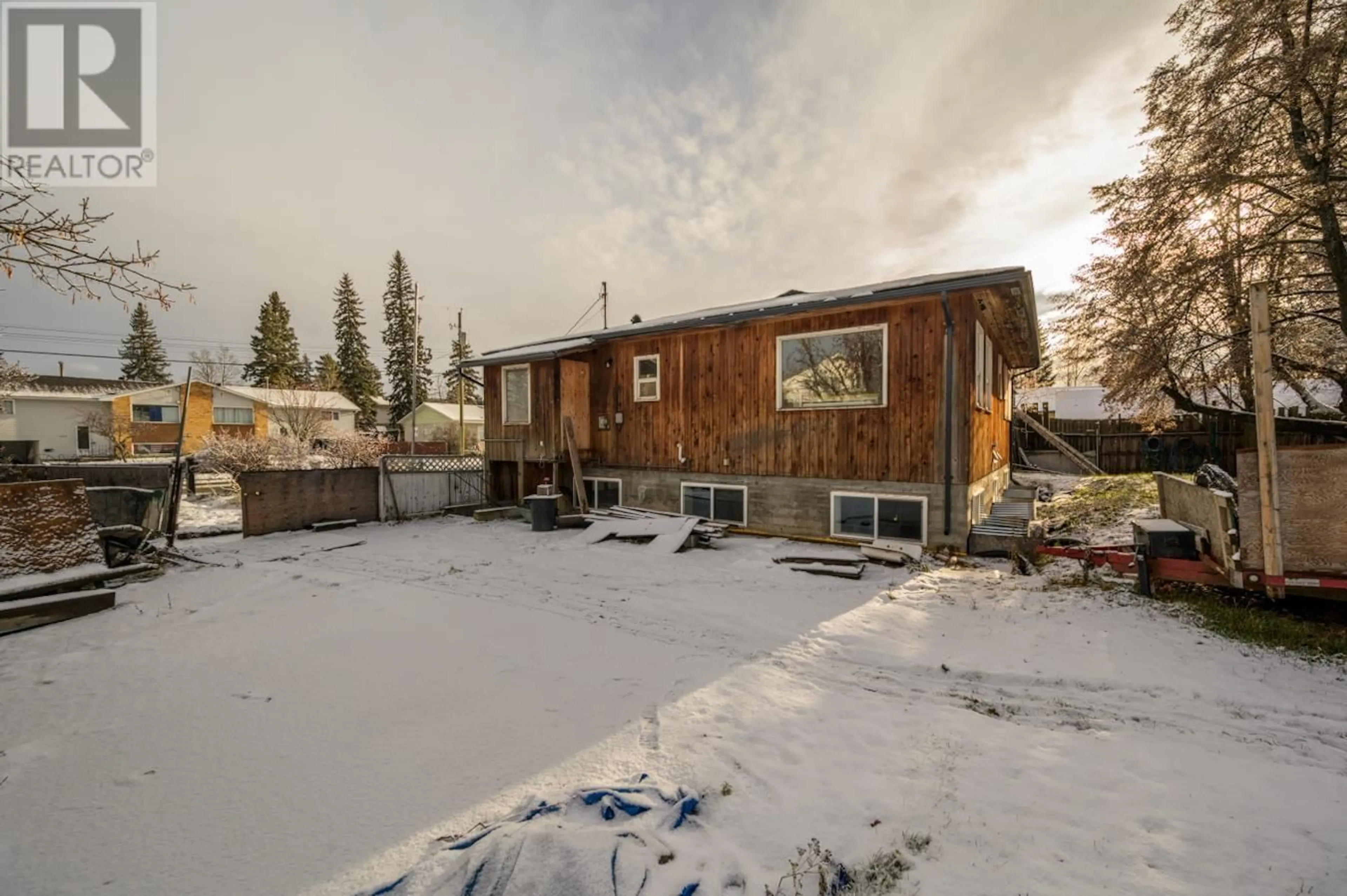 Frontside or backside of a home, the fenced backyard for 2221 SPRUCE STREET, Prince George British Columbia V2L2R7