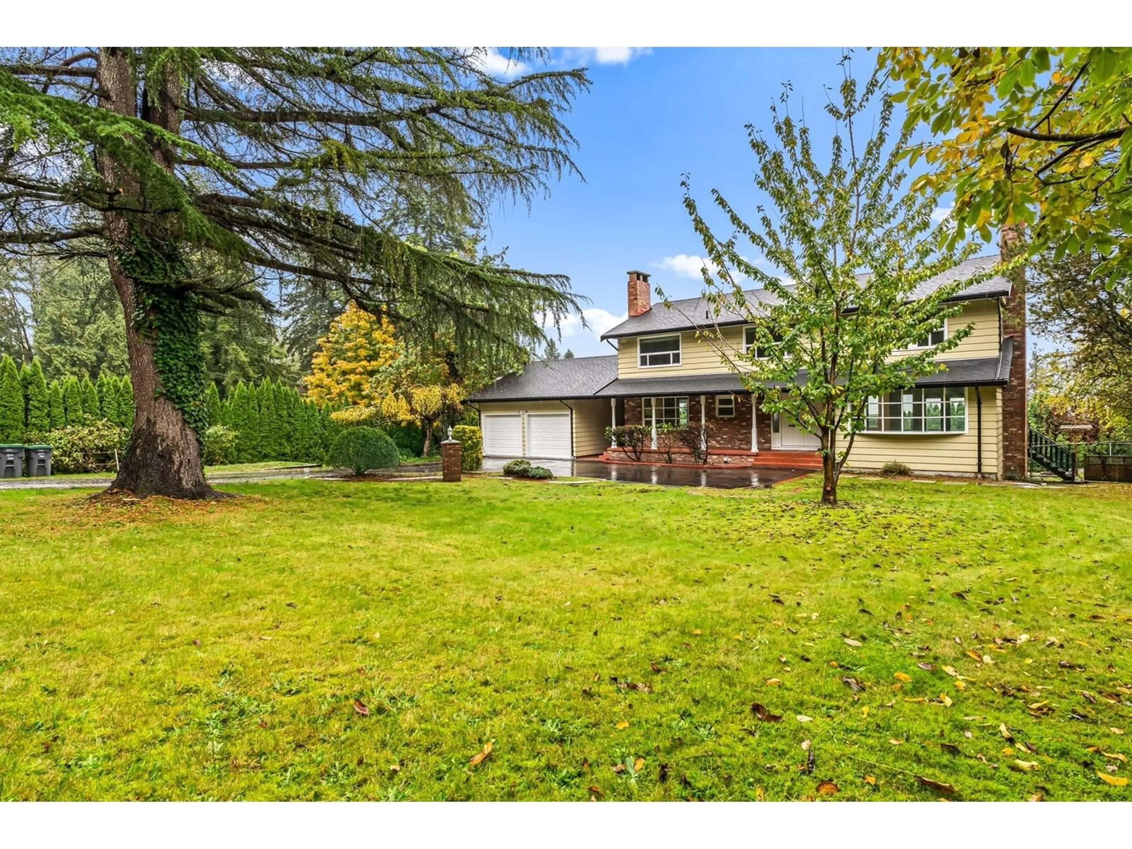 Frontside or backside of a home, the fenced backyard for 12940 54A AVENUE, Surrey British Columbia V3X3C9