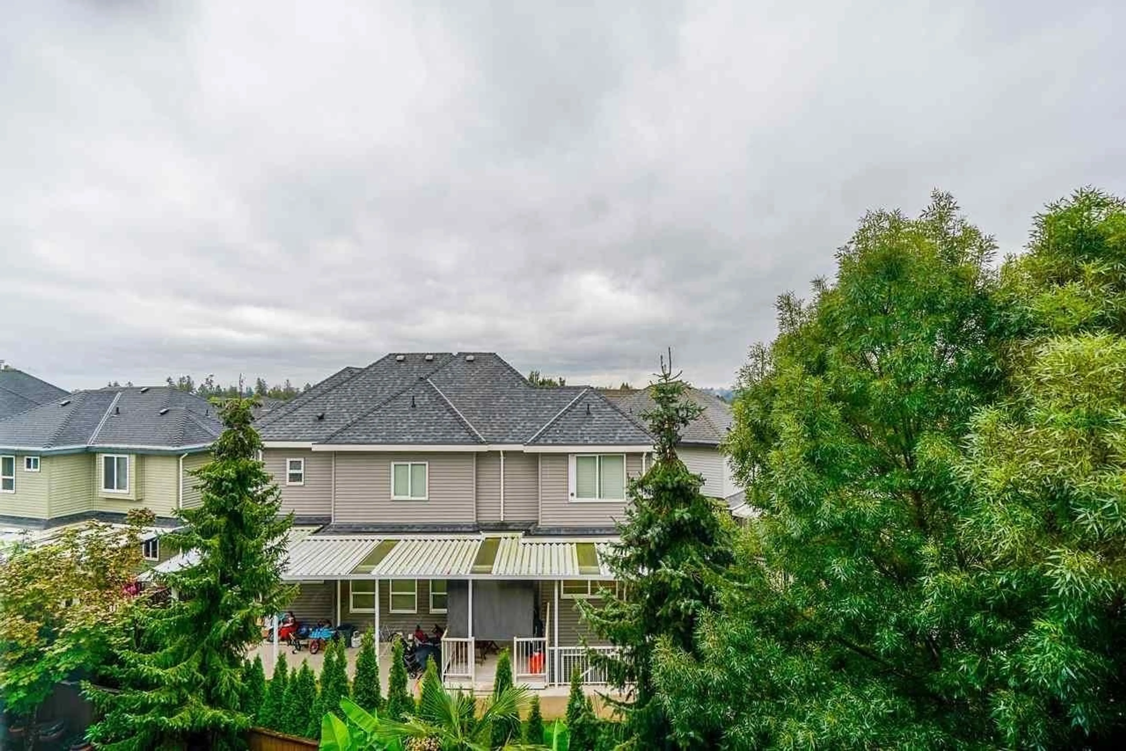 A pic from exterior of the house or condo, the fenced backyard for 17 7156 144 STREET, Surrey British Columbia V3W1V5