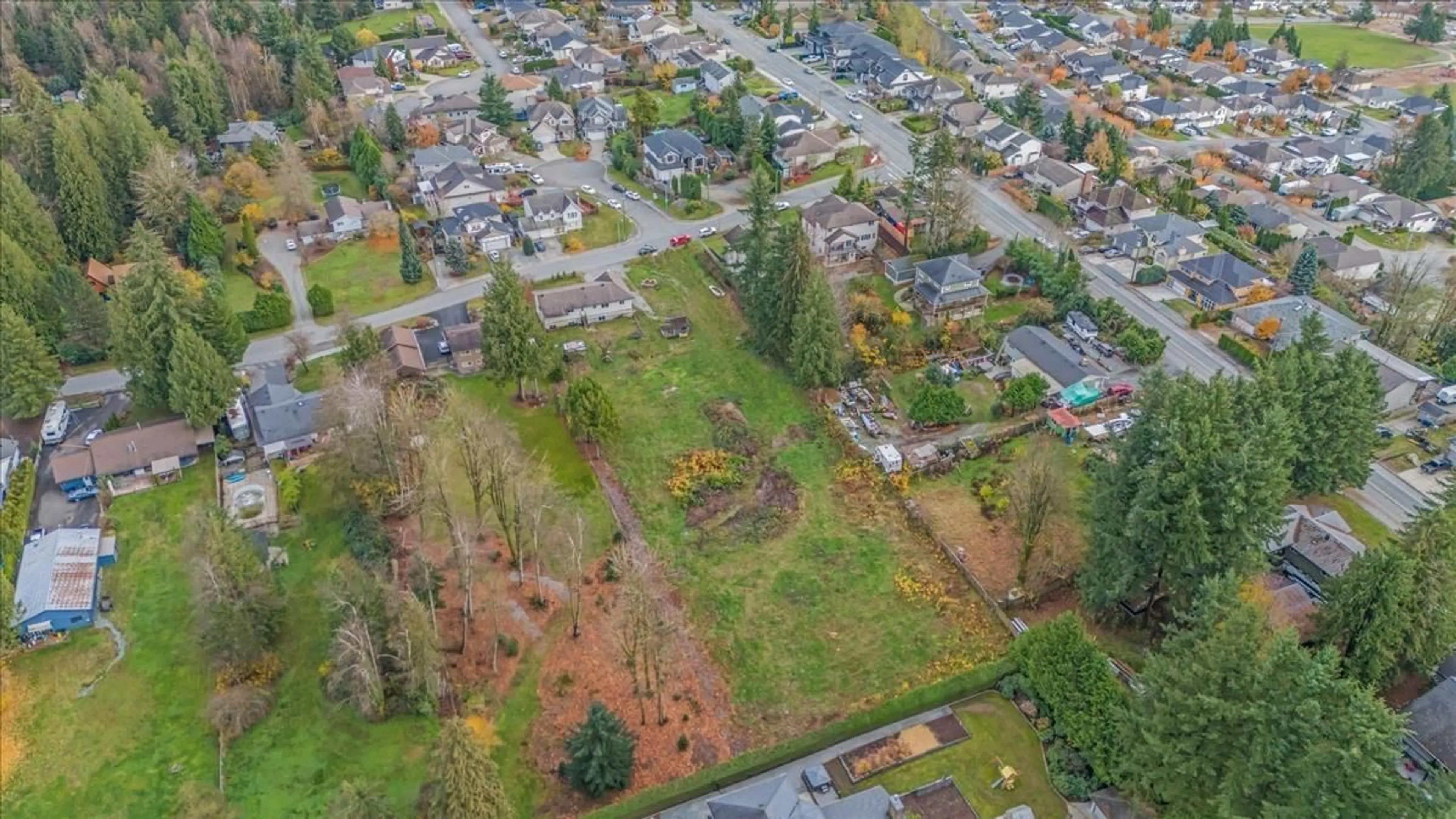 Frontside or backside of a home, the fenced backyard for 8443 HARMS STREET, Mission British Columbia V2V6E2