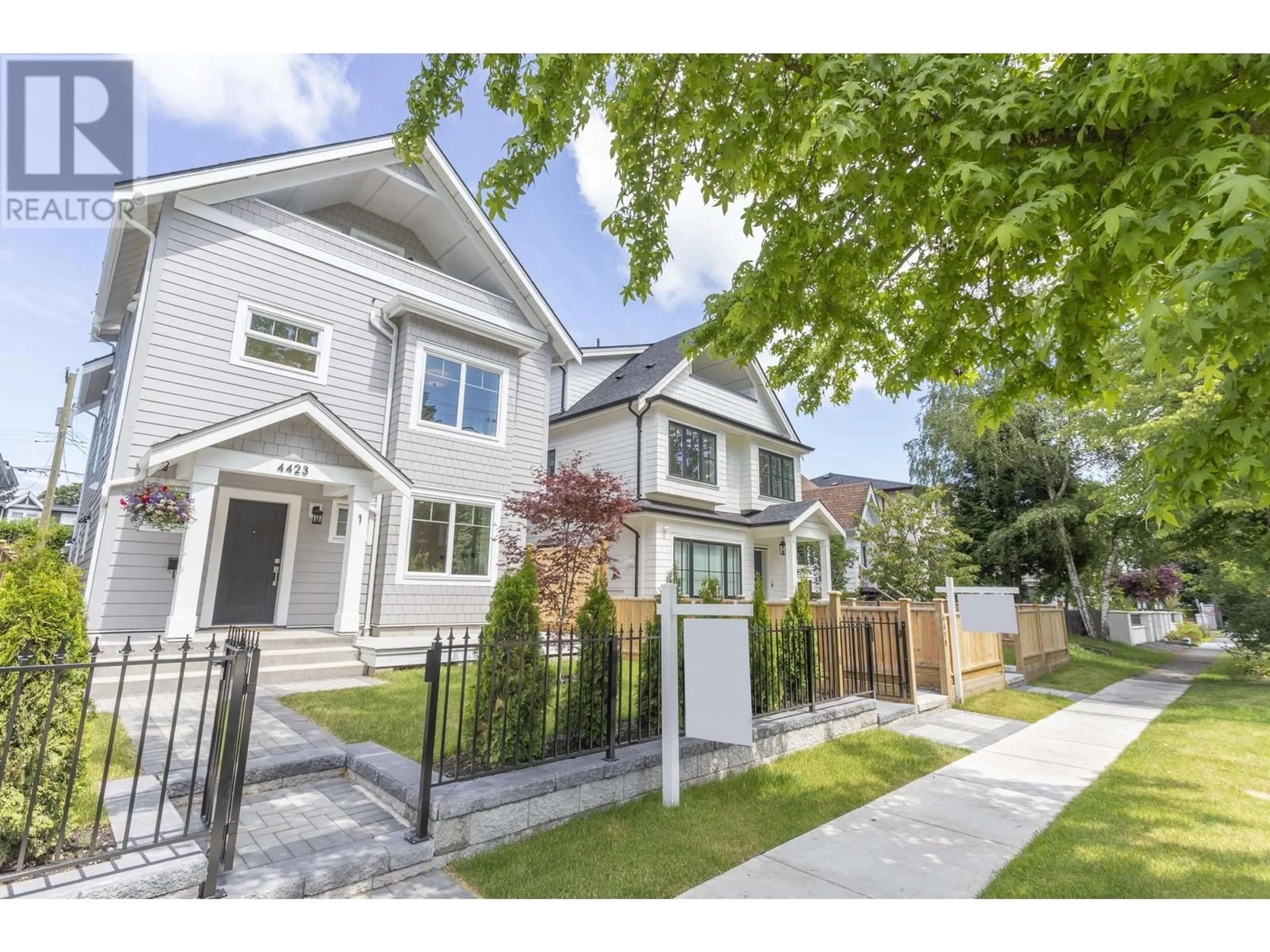 Frontside or backside of a home, the fenced backyard for 1 4423 W 16TH AVENUE, Vancouver British Columbia V6R3E7