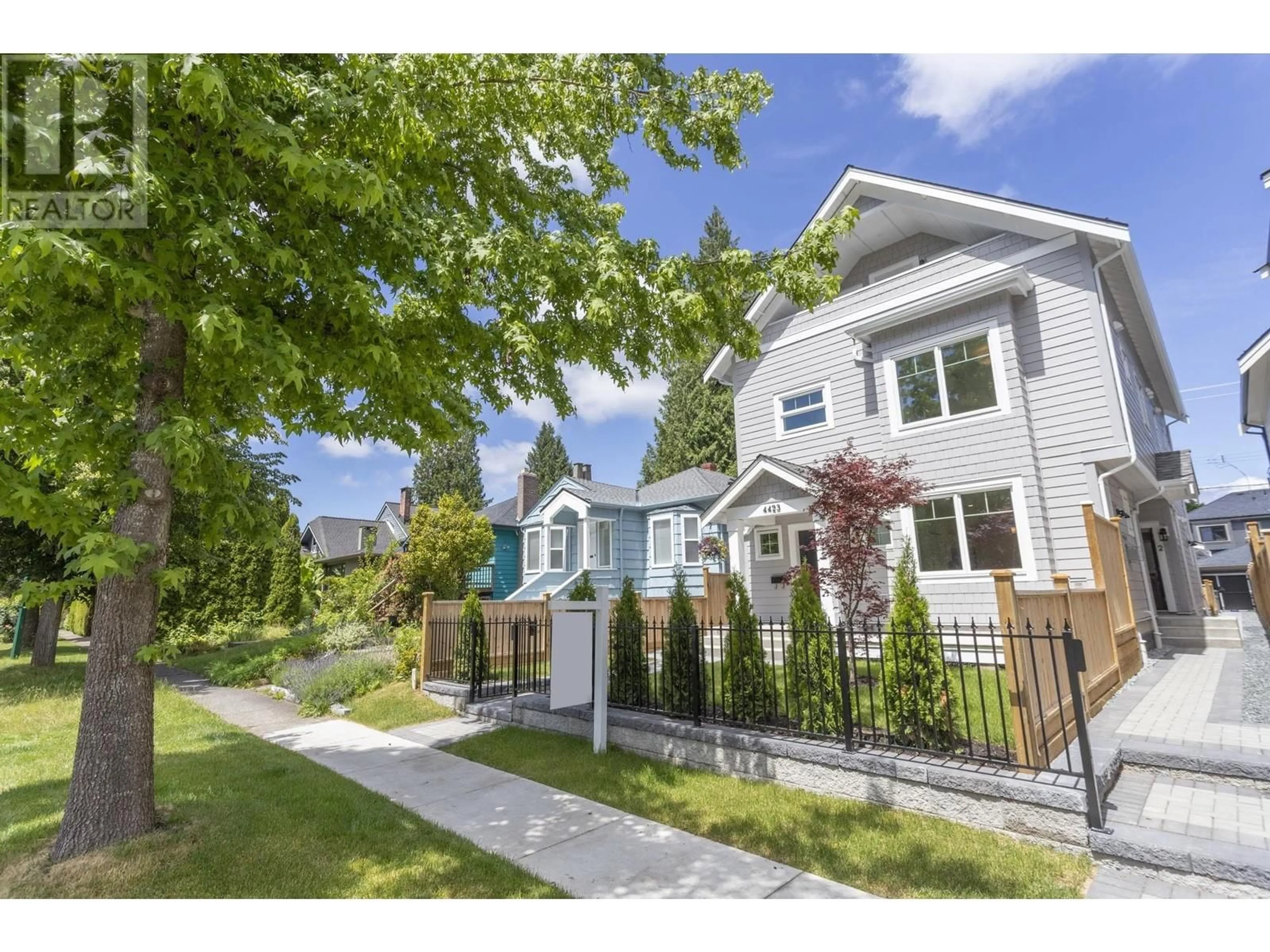 Frontside or backside of a home, the fenced backyard for 1 4423 W 16TH AVENUE, Vancouver British Columbia V6R3E7