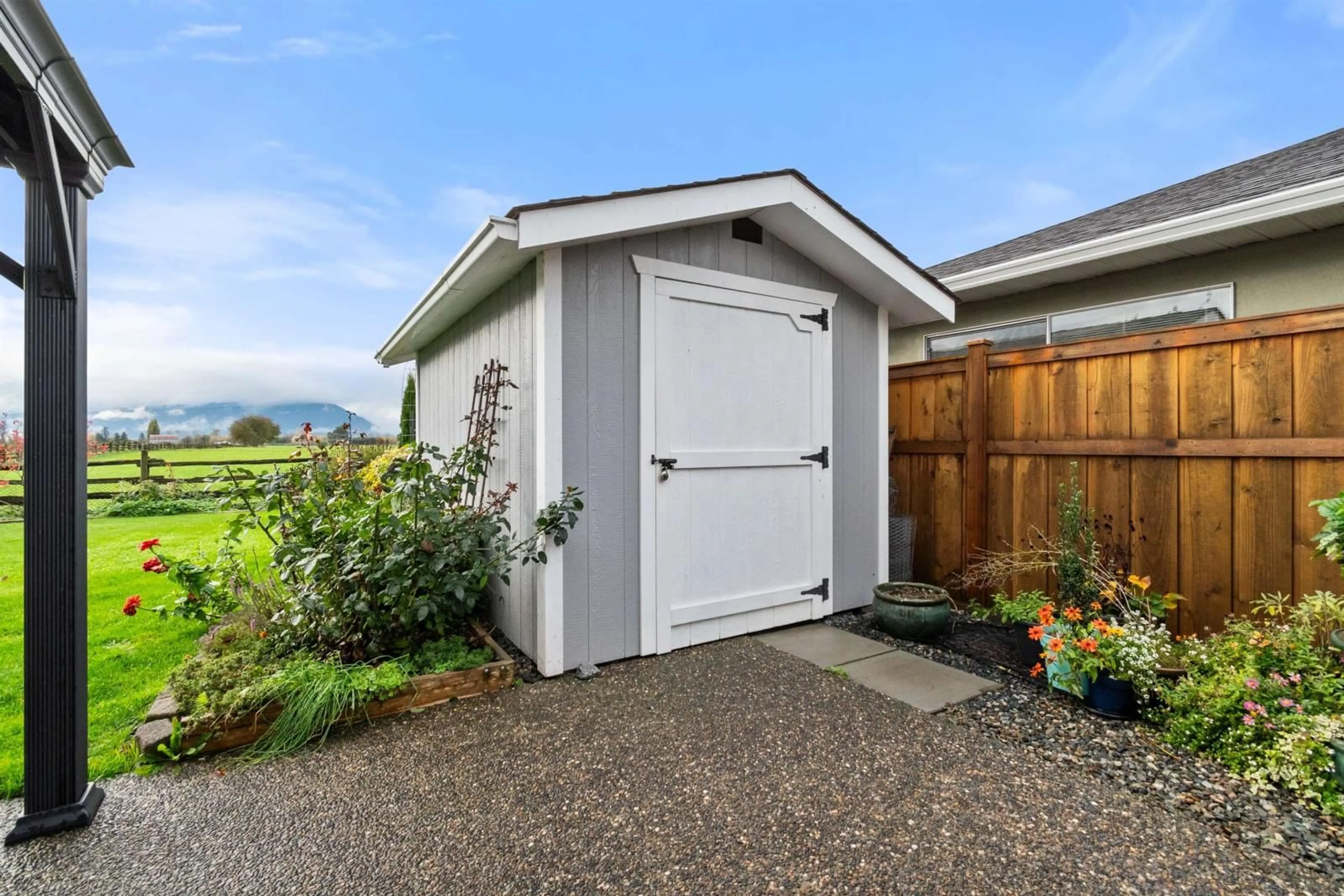 Frontside or backside of a home, the fenced backyard for 6801 WILTSHIRE STREET, Chilliwack British Columbia V2R2Z3