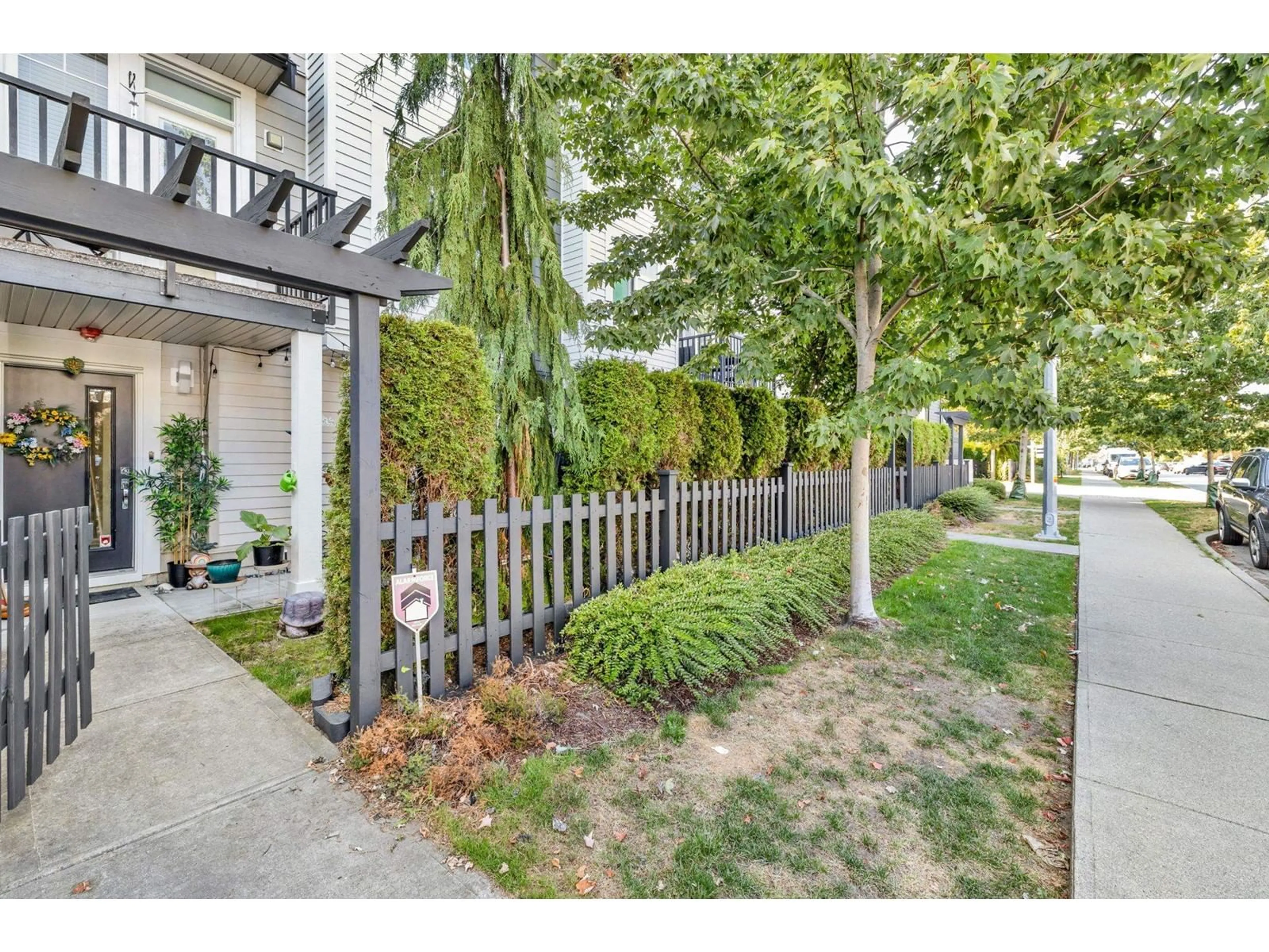 A pic from exterior of the house or condo, the fenced backyard for 3 7665 209 STREET, Langley British Columbia V2Y0V2