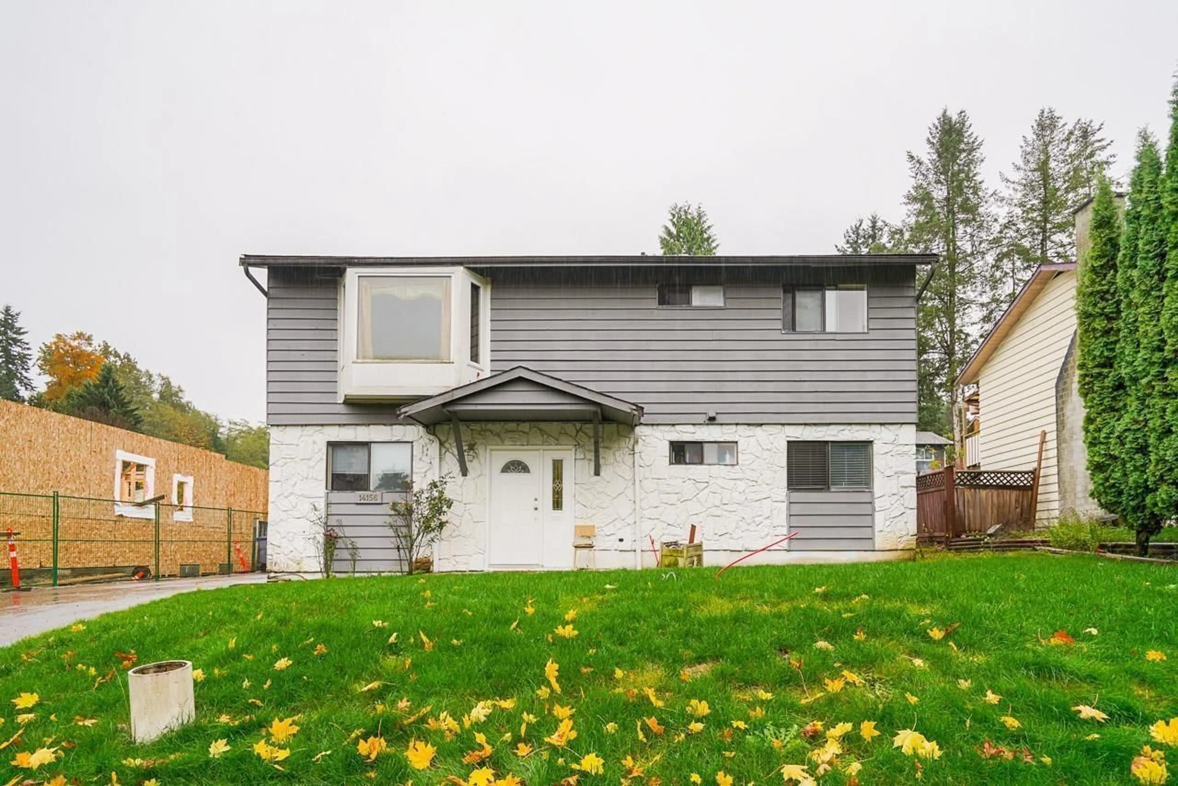 A pic from exterior of the house or condo, the fenced backyard for 14156 79 AVENUE, Surrey British Columbia V3W6J6