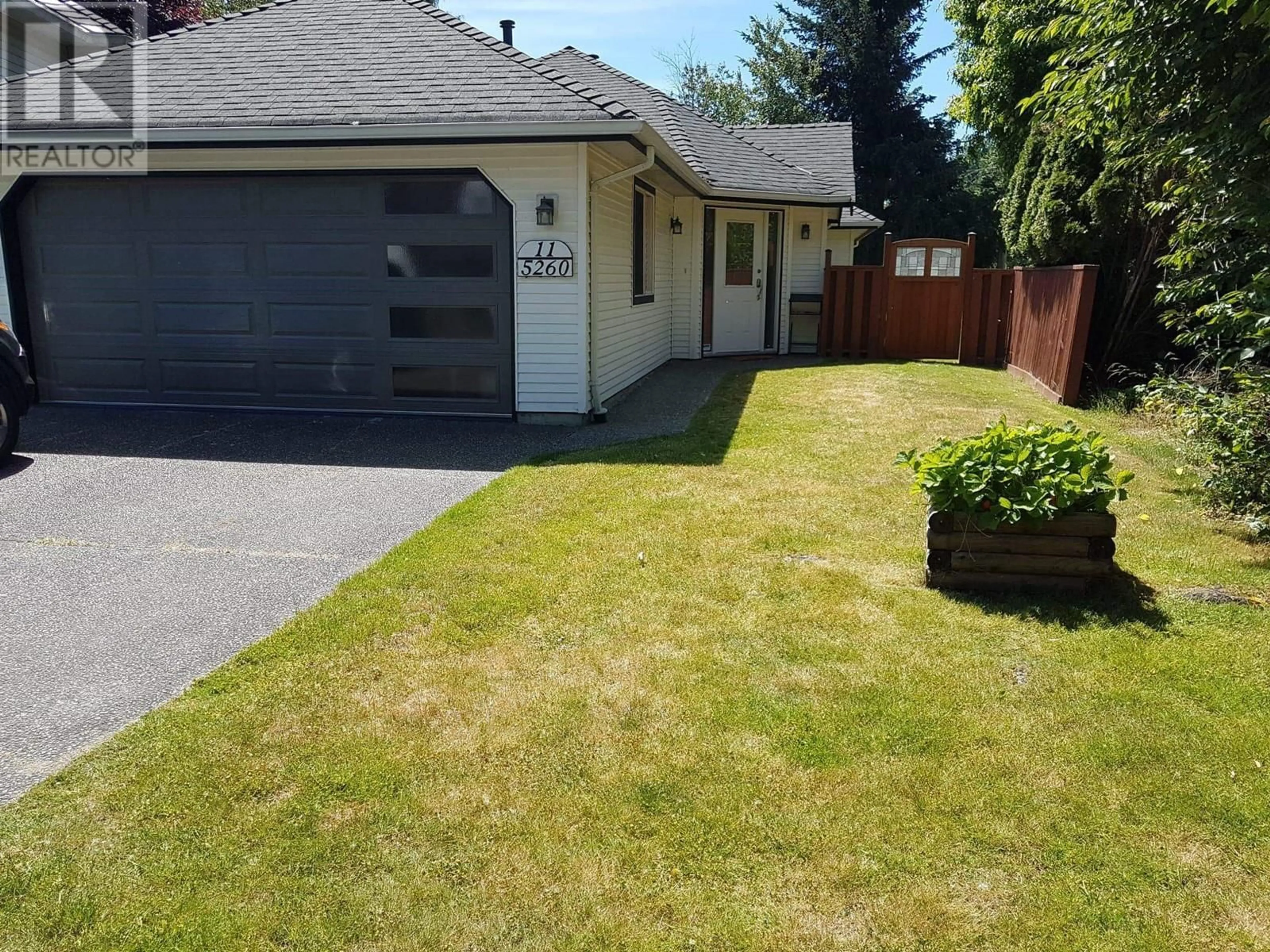 Frontside or backside of a home, the fenced backyard for 11 5260 FERRY ROAD, Delta British Columbia V4K4Y4