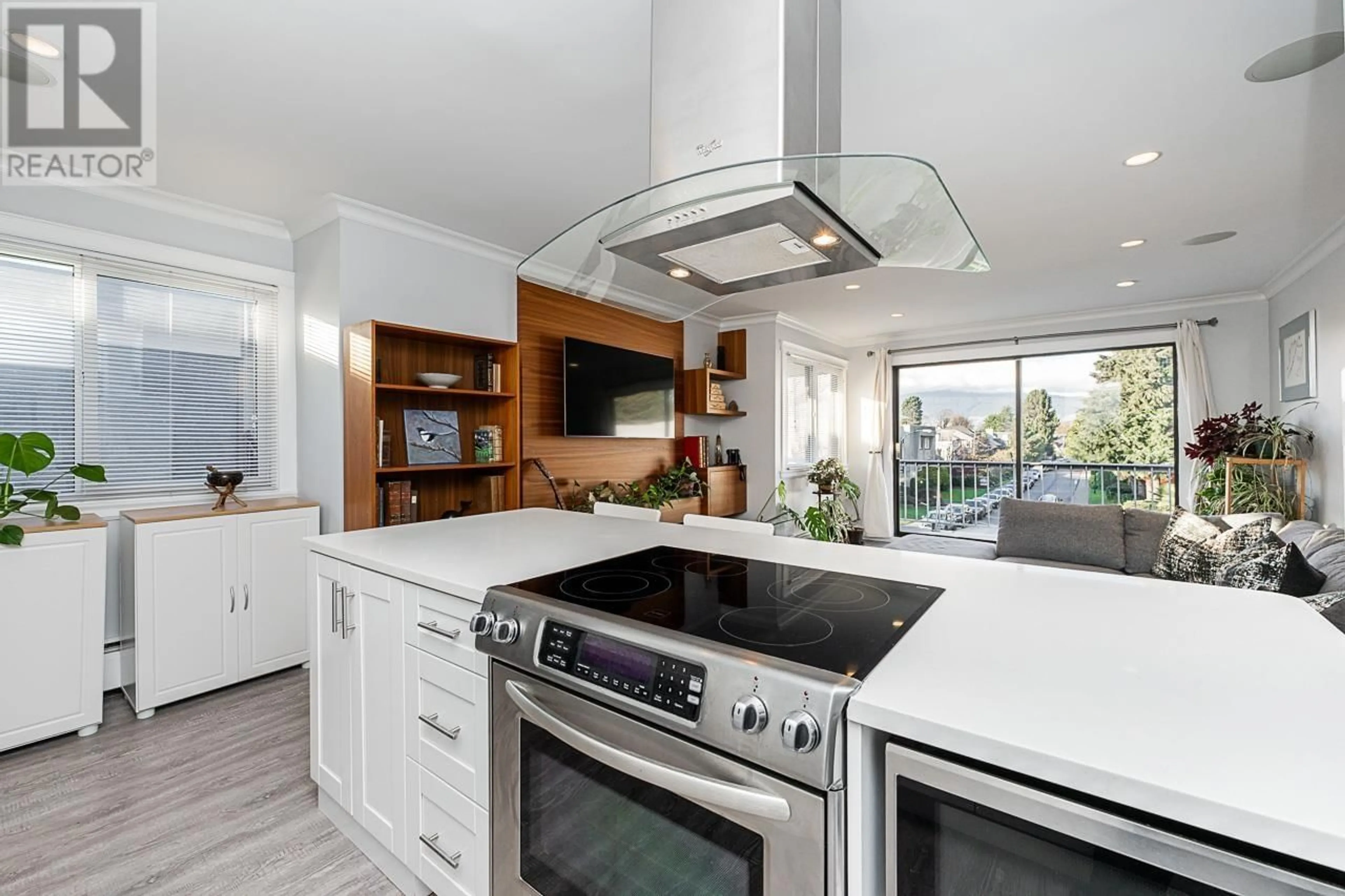 Contemporary kitchen, wood floors for 303 2040 CORNWALL AVENUE, Vancouver British Columbia V6J1E1