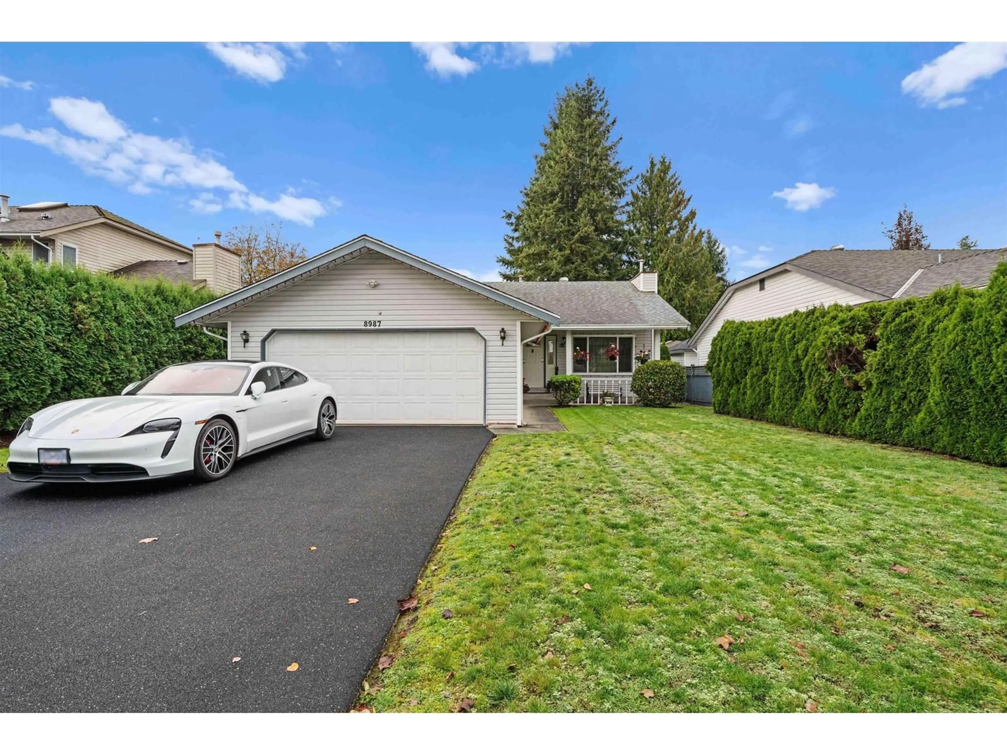 A pic from exterior of the house or condo, the fenced backyard for 8987 157 STREET, Surrey British Columbia V4N2Y5