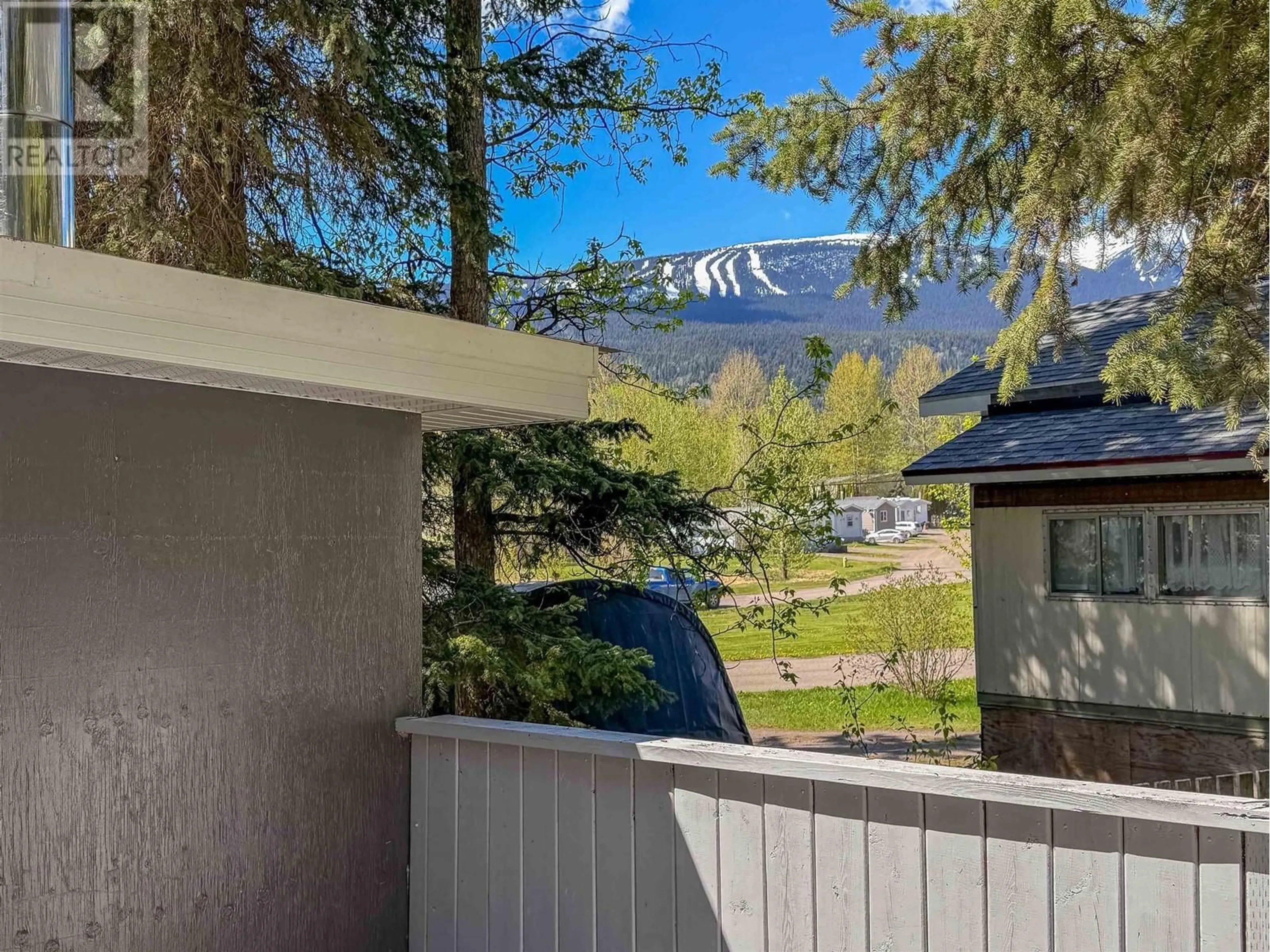 A pic from outside/outdoor area/front of a property/back of a property/a pic from drone, mountain view for 81 - 4430 16 HIGHWAY, Smithers British Columbia V0J2N0