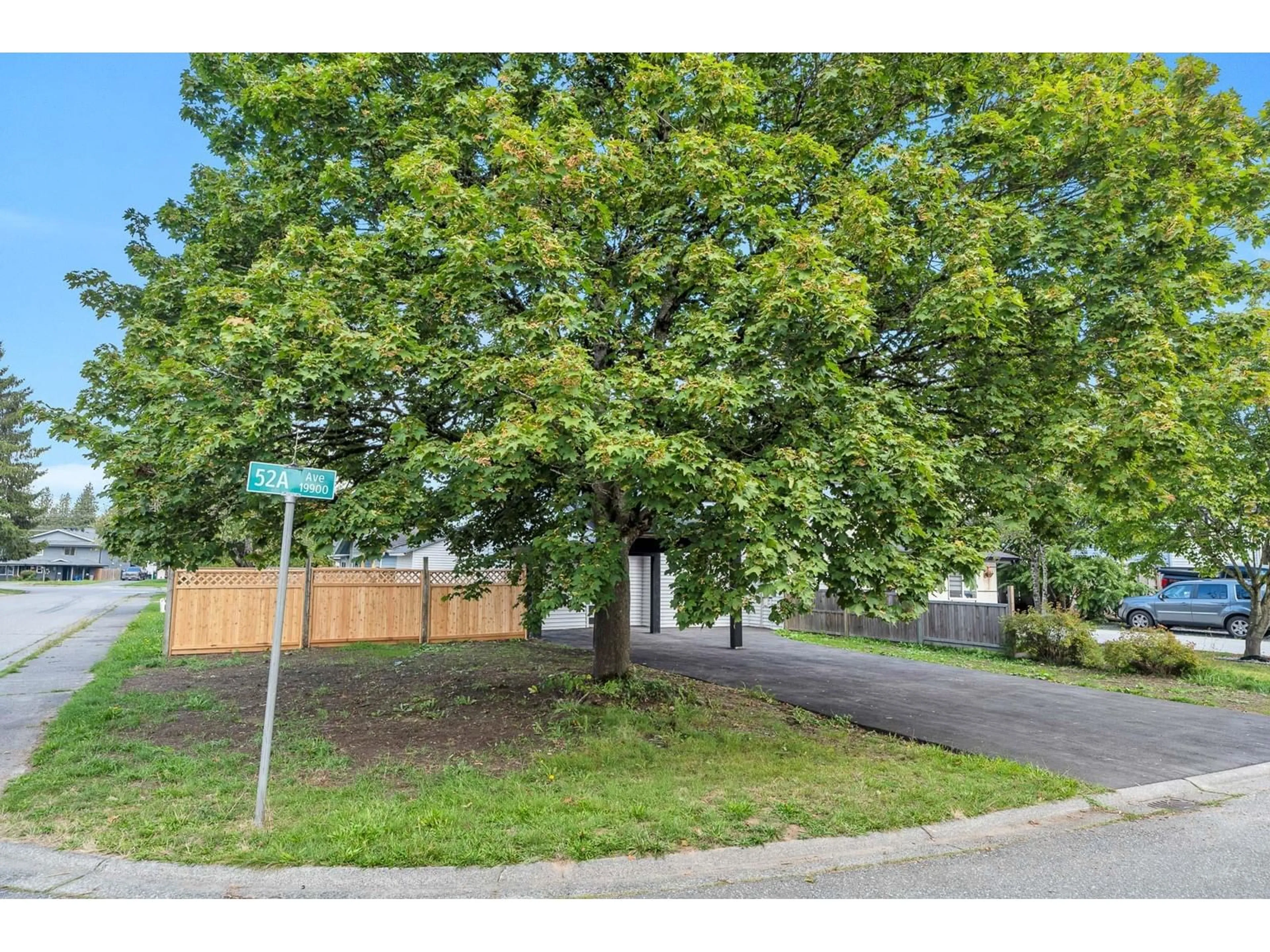 Frontside or backside of a home, the fenced backyard for 19911 52A AVENUE, Langley British Columbia V3A6T2