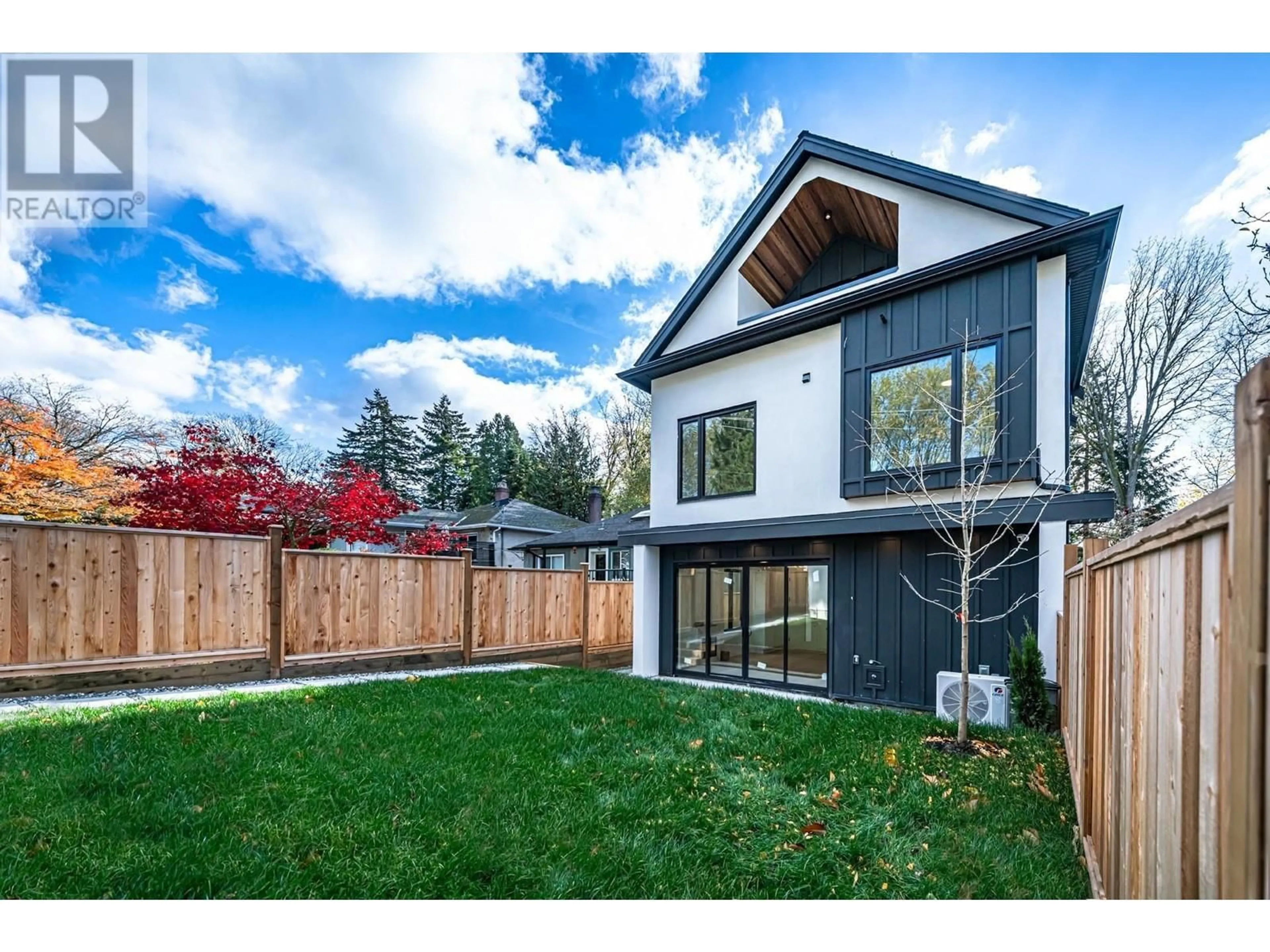 Frontside or backside of a home, the fenced backyard for 1 3841 W 27TH AVENUE, Vancouver British Columbia V6S1R4