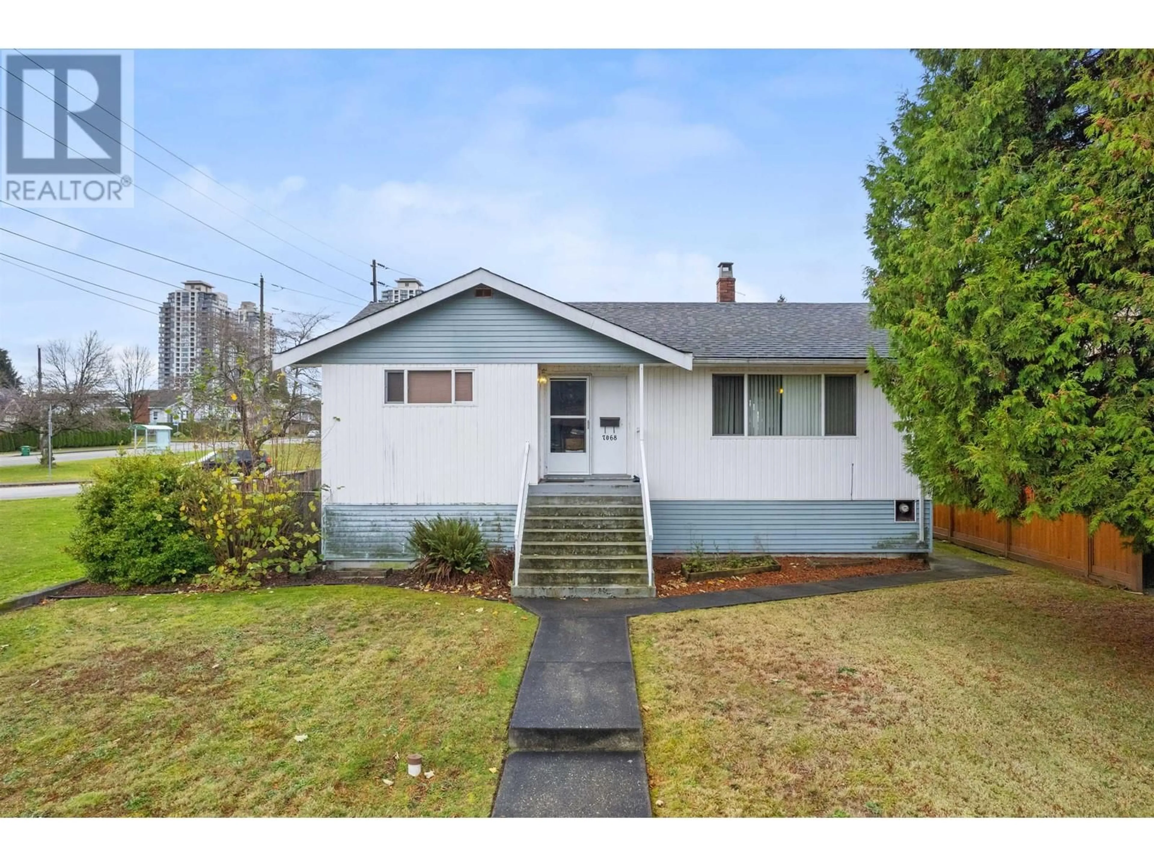 Frontside or backside of a home, the fenced backyard for 7068 BURFORD STREET, Burnaby British Columbia V5E1S2