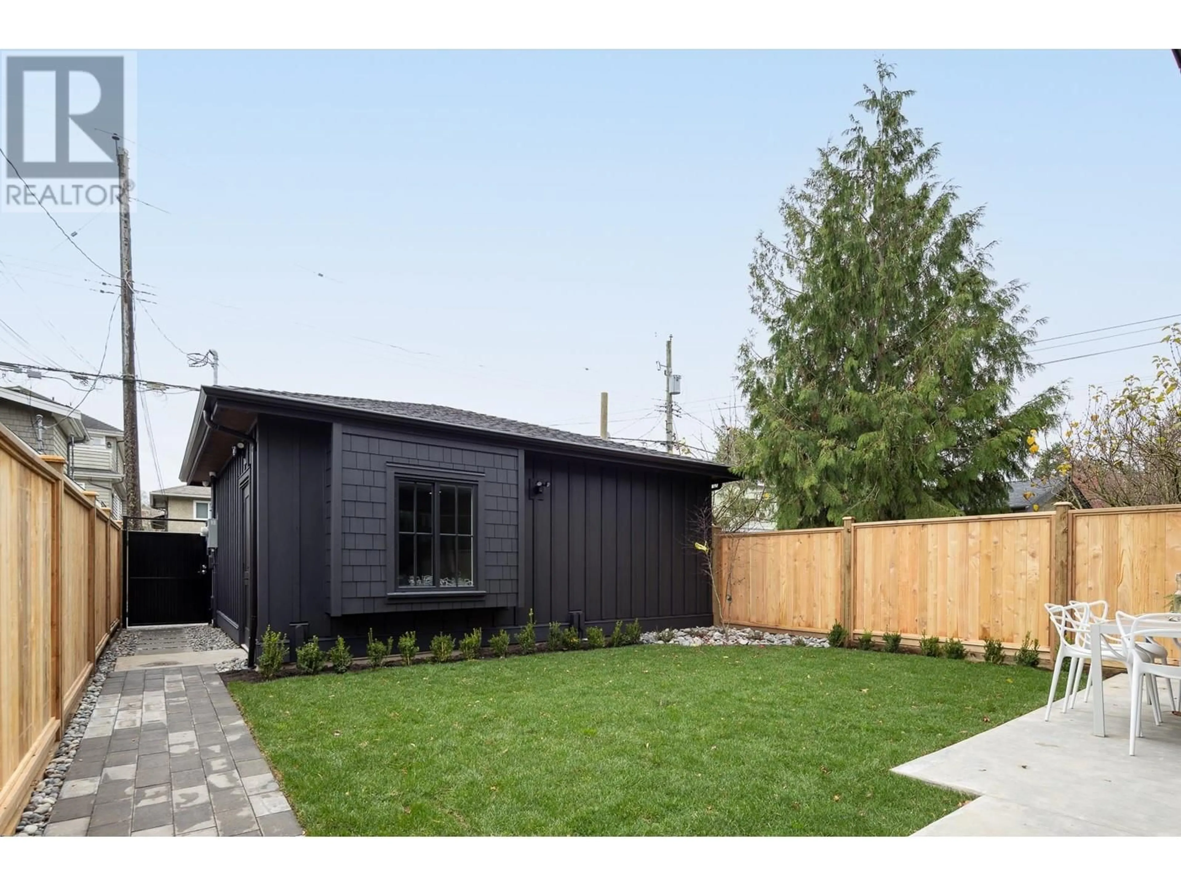 Frontside or backside of a home, the fenced backyard for 2 3268 W 15TH AVENUE, Vancouver British Columbia V6K3A9