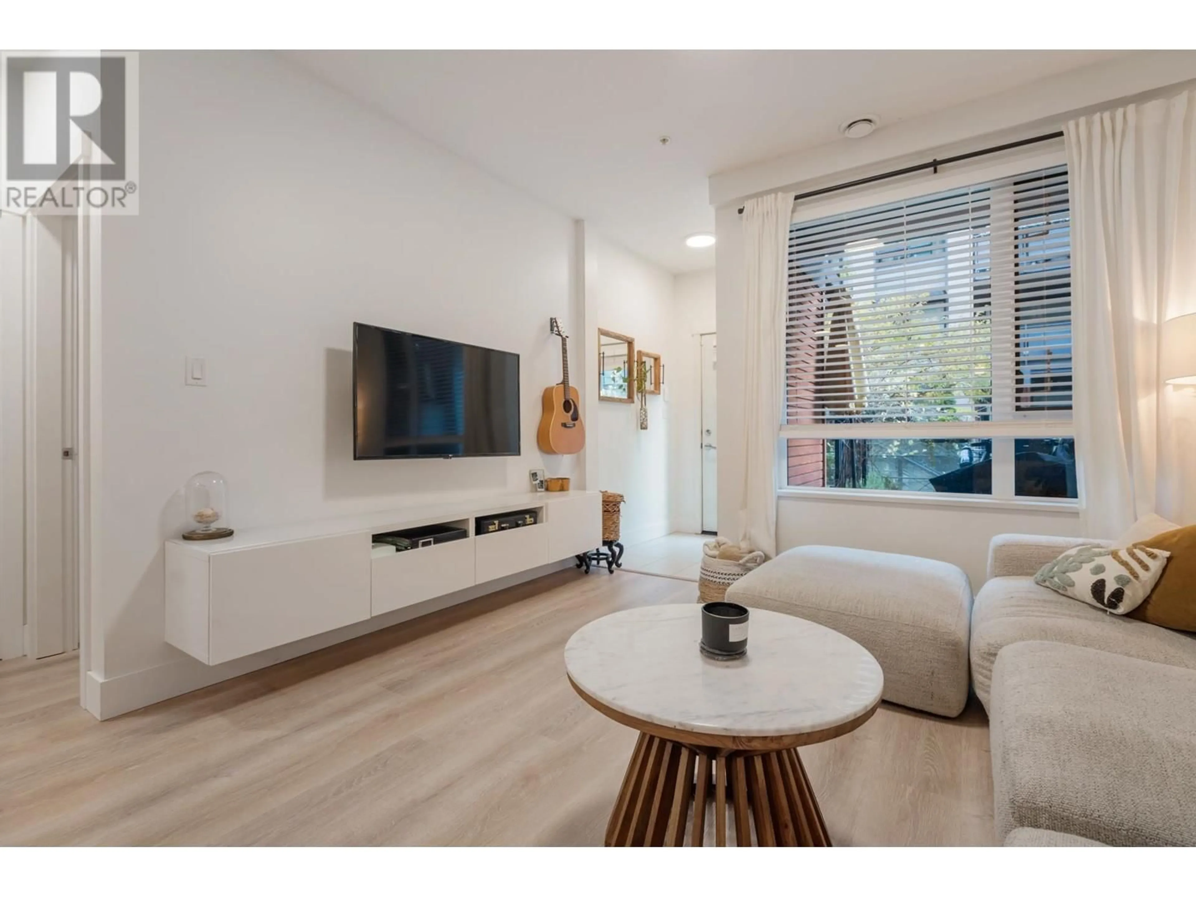 Living room, wood floors for 107 3133 RIVERWALK AVENUE, Vancouver British Columbia V5S0A7