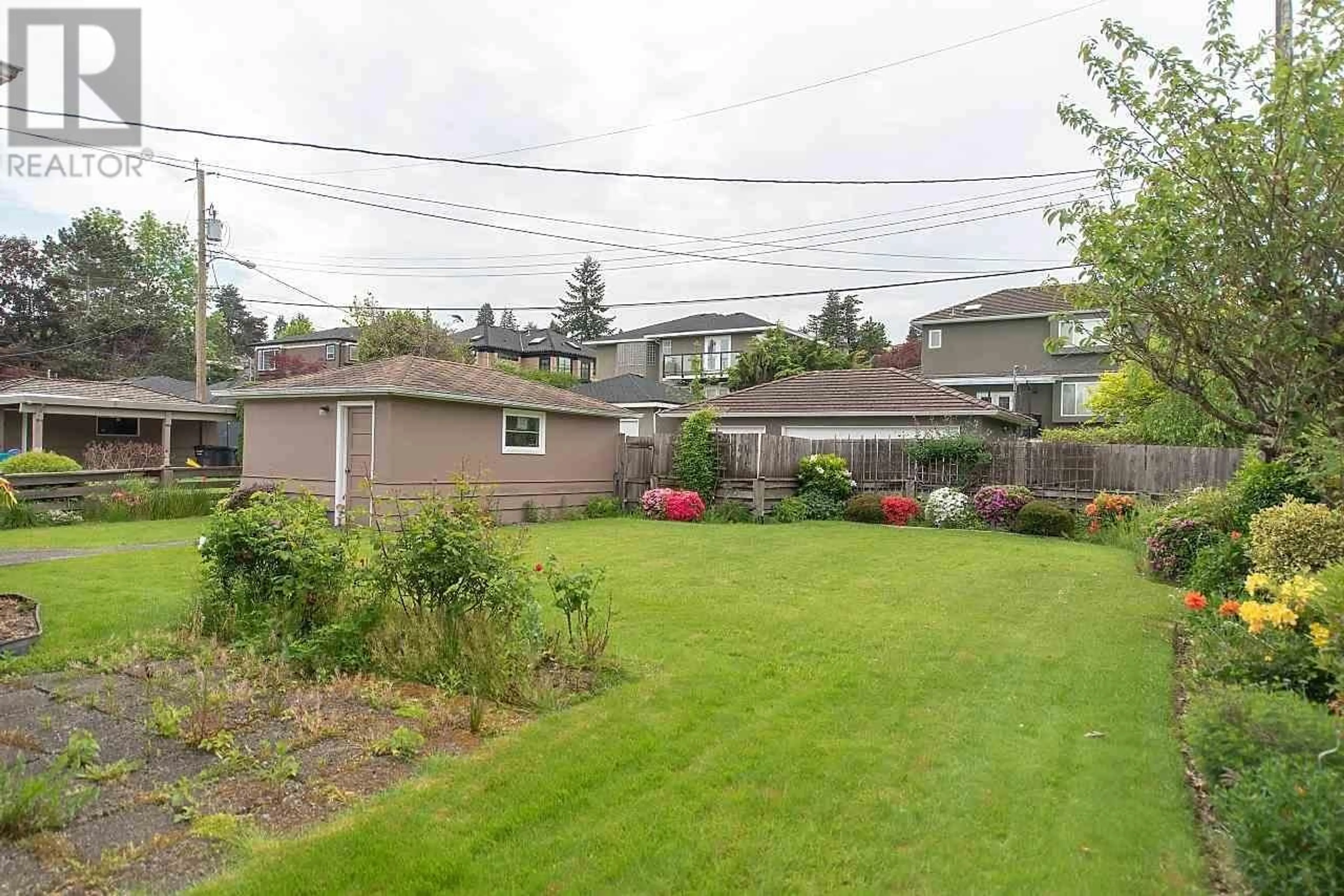 Frontside or backside of a home, the fenced backyard for 4443 BRAKENRIDGE STREET, Vancouver British Columbia V6L2H1