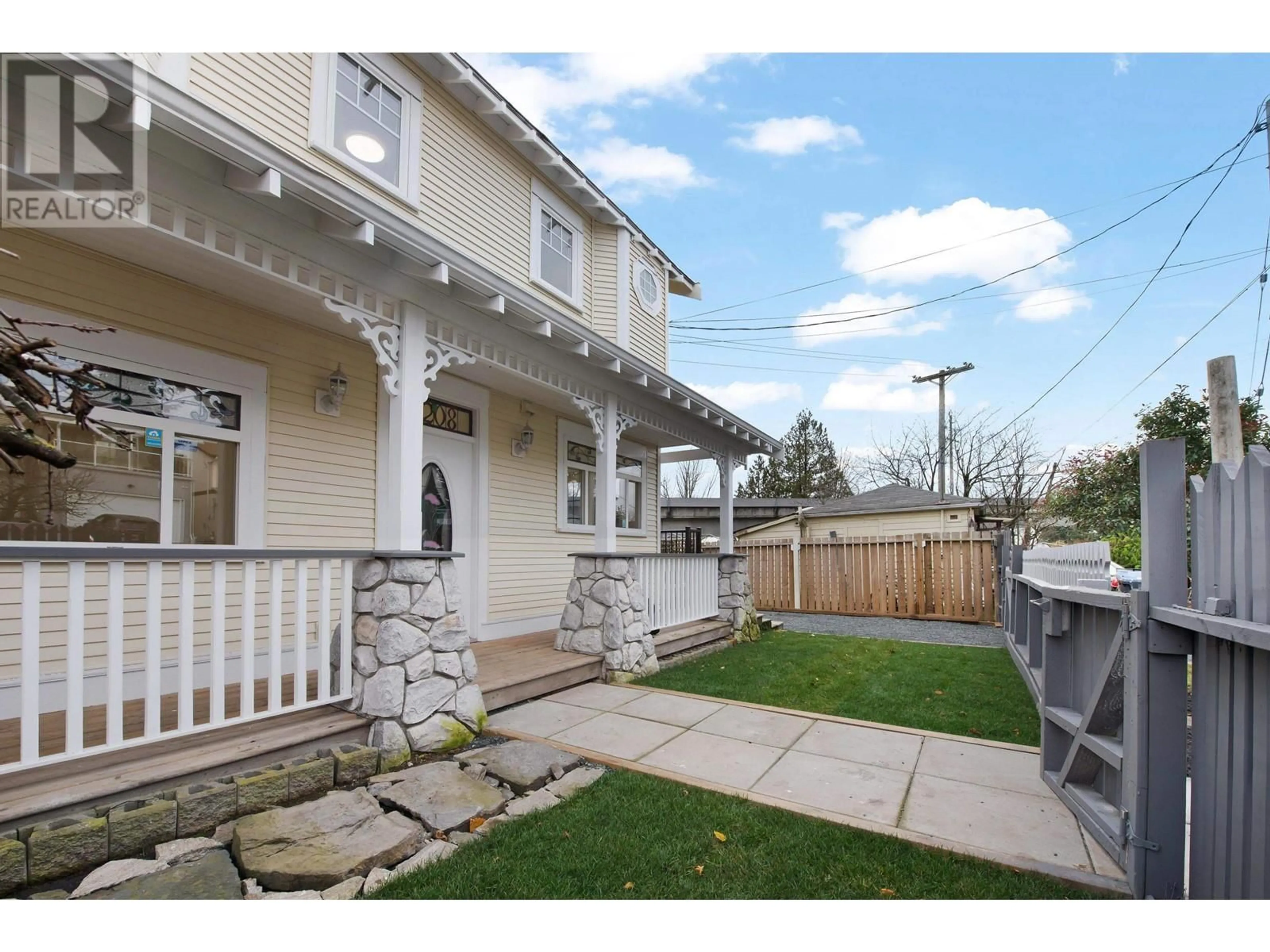 Frontside or backside of a home, the fenced backyard for 2208 HAMILTON STREET, New Westminster British Columbia V3M2R1