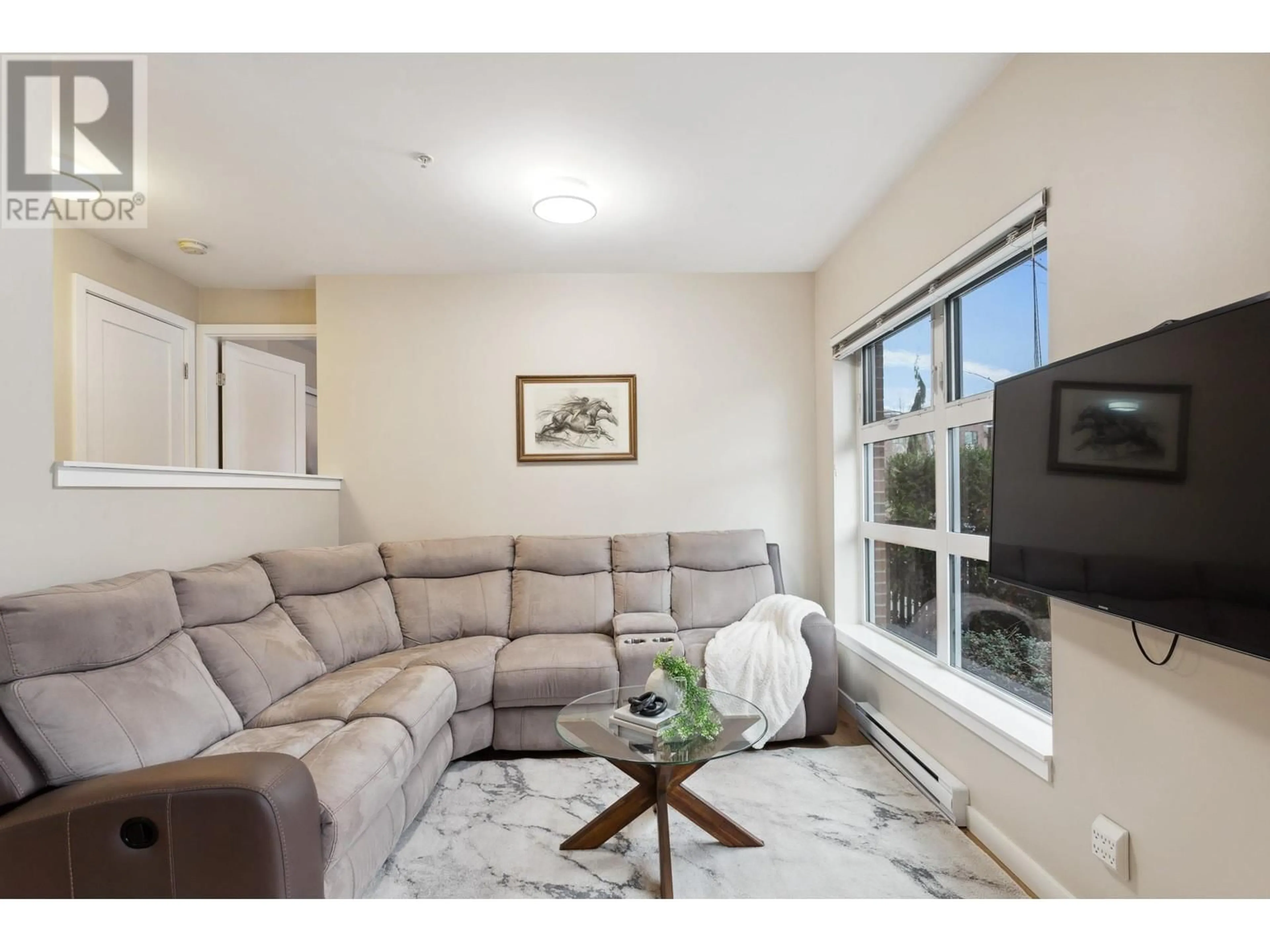 Living room, wood floors for 107 215 BROOKES STREET, New Westminster British Columbia V3M0G5