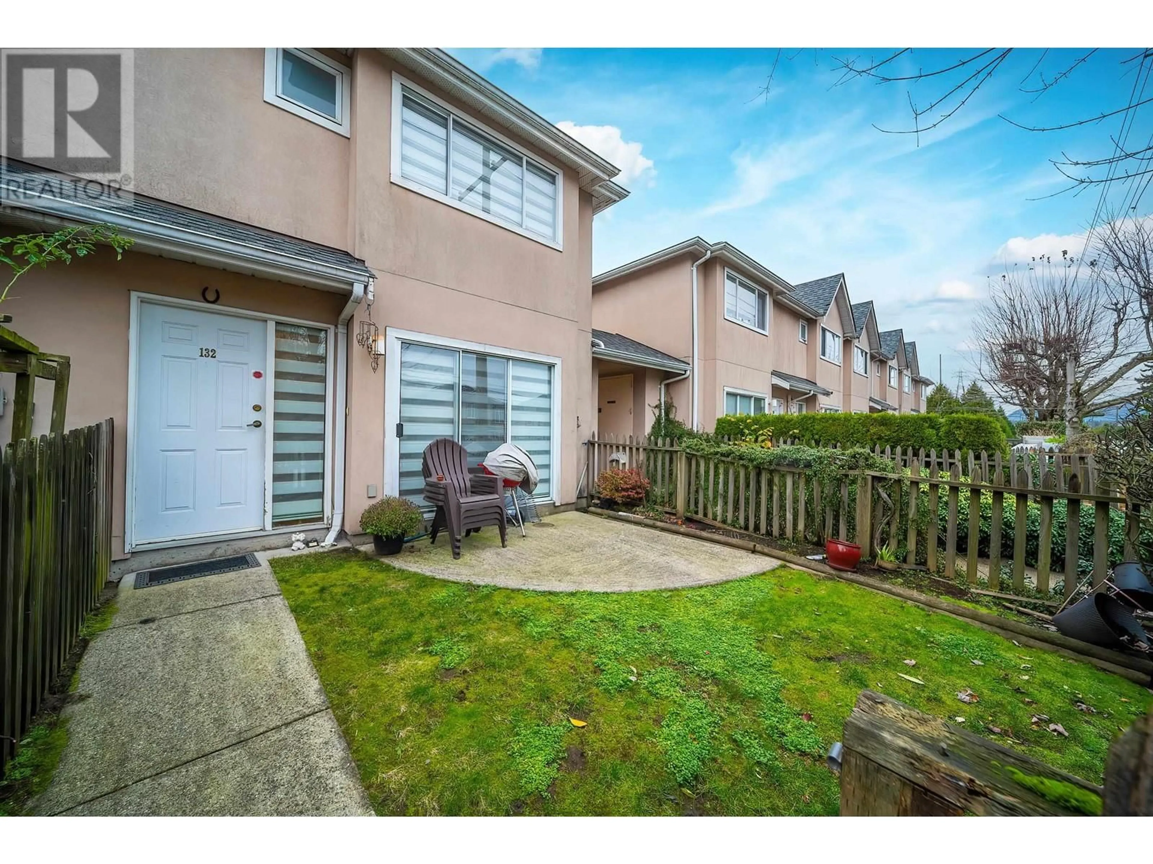 A pic from exterior of the house or condo, the fenced backyard for 132 2211 NO. 4 ROAD, Richmond British Columbia V6X3X1