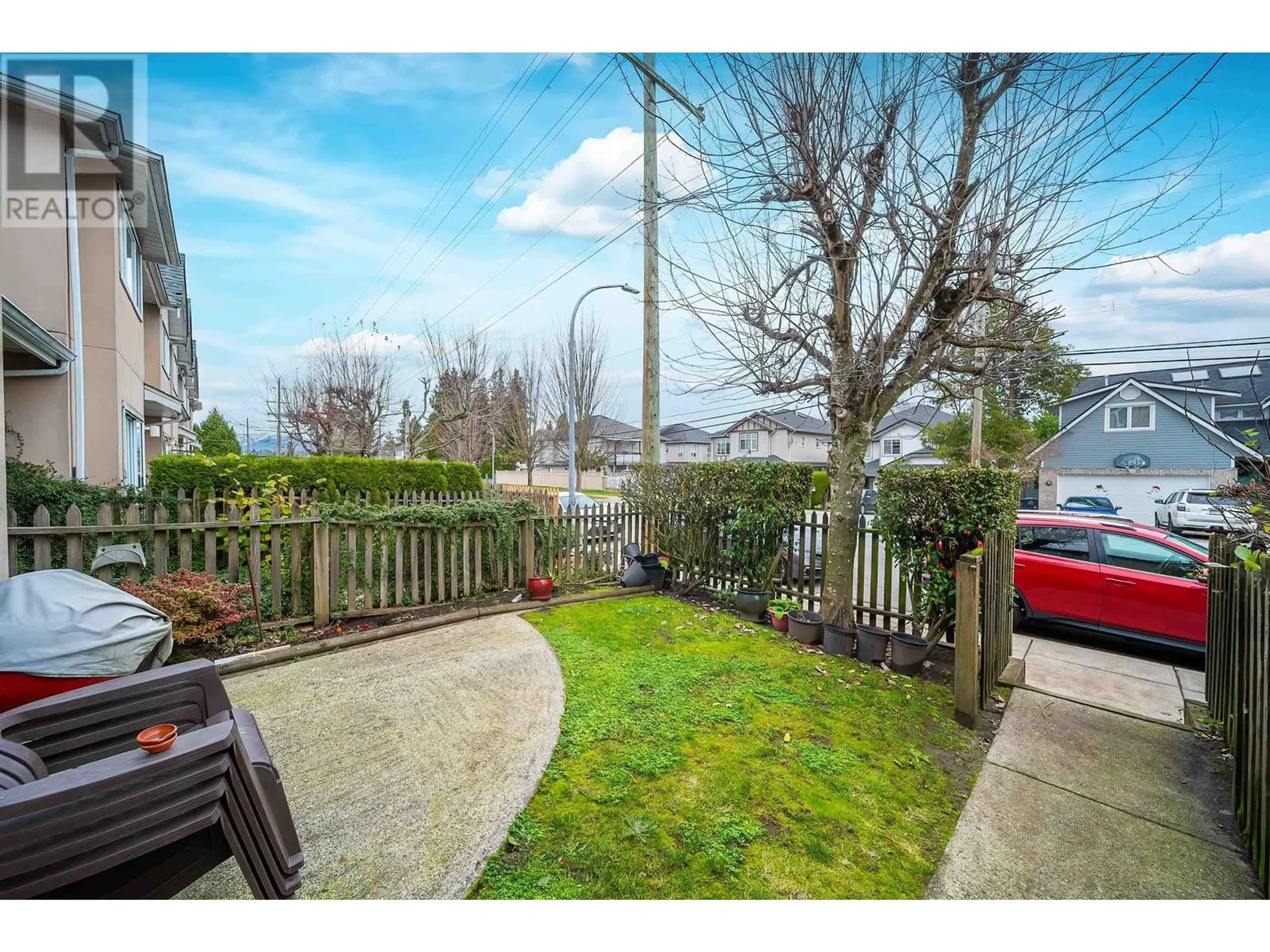 A pic from exterior of the house or condo, the fenced backyard for 132 2211 NO. 4 ROAD, Richmond British Columbia V6X3X1