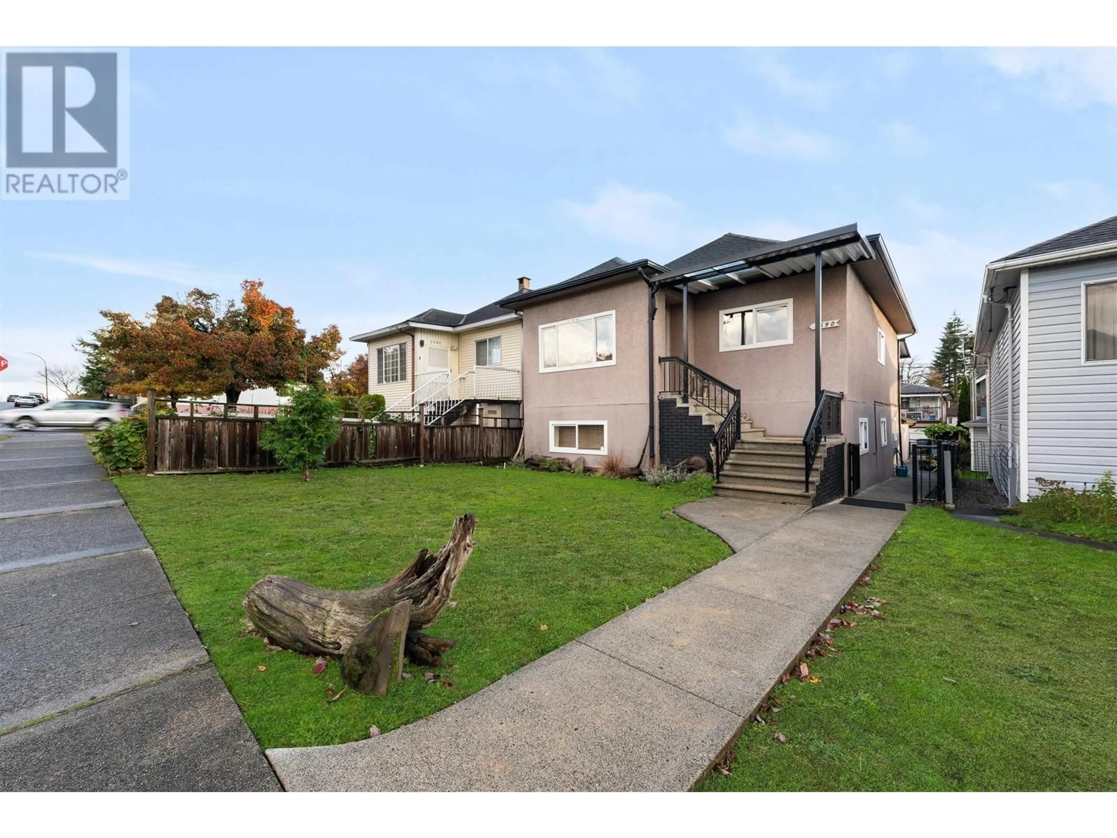 Frontside or backside of a home, the fenced backyard for 2590 E GEORGIA STREET, Vancouver British Columbia V5K2J7