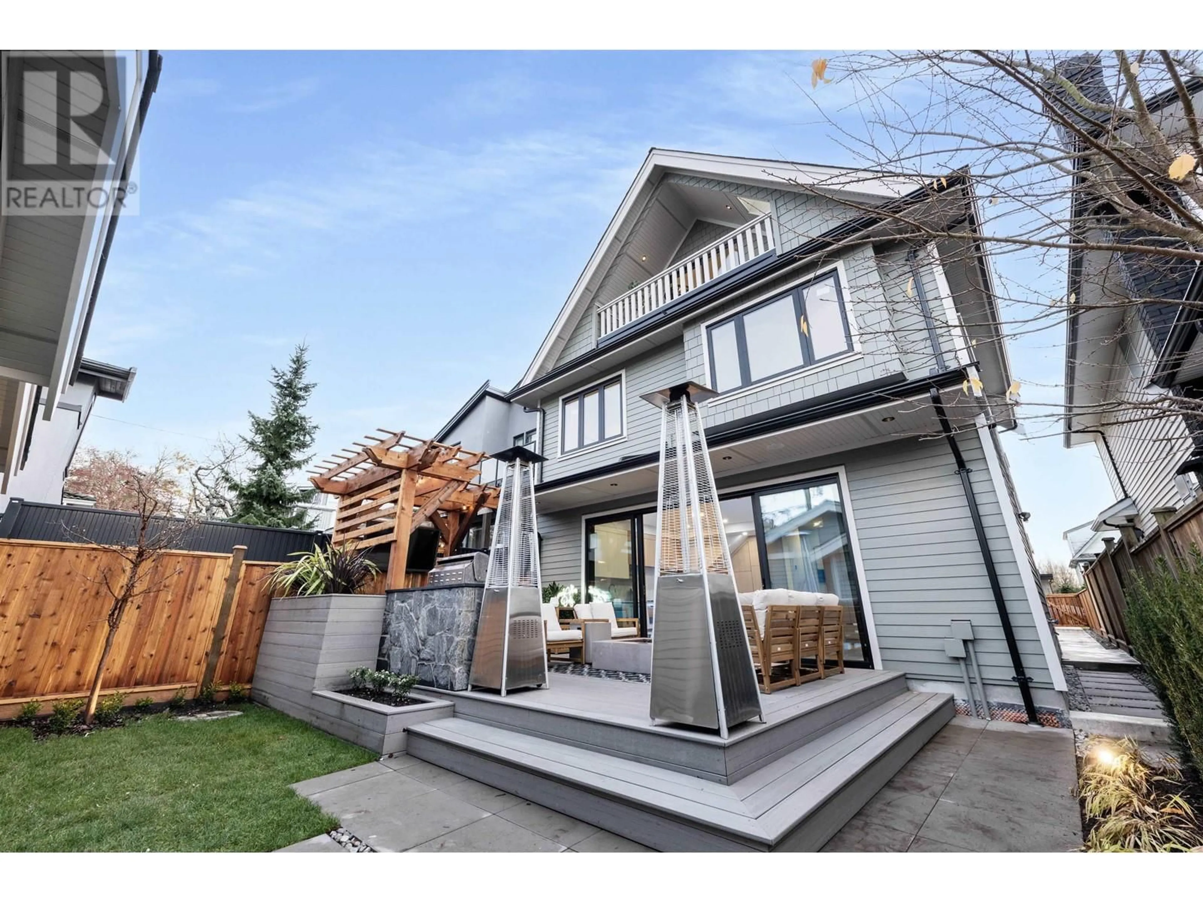 Frontside or backside of a home, the fenced backyard for 2 3565 TRIUMPH STREET, Vancouver British Columbia V5K1V2