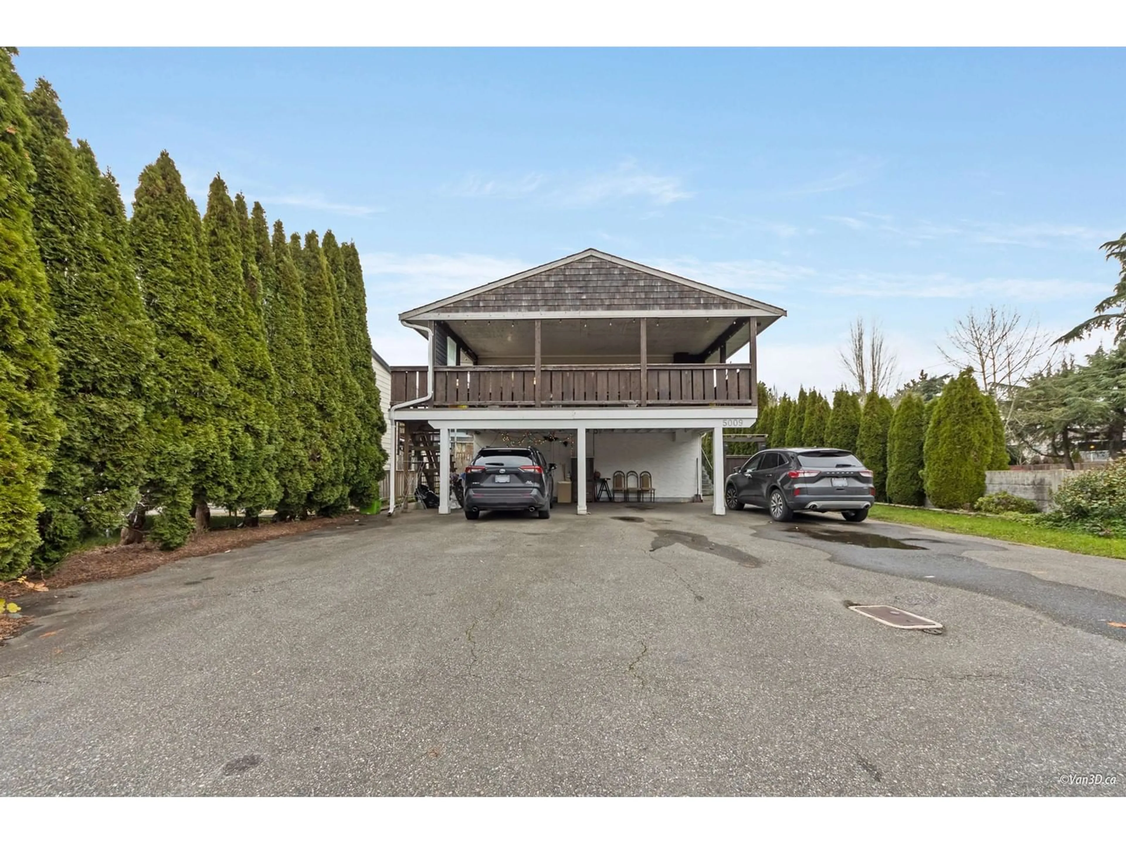 Frontside or backside of a home, the street view for 5009 208 STREET, Langley British Columbia V3A7A2