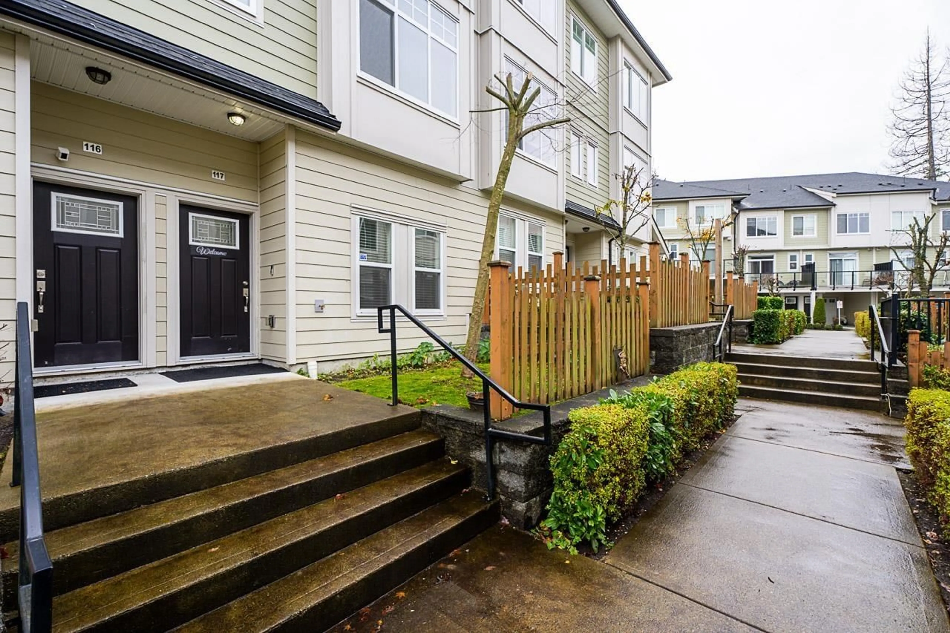 A pic from exterior of the house or condo, the fenced backyard for 117 13670 62 AVENUE, Surrey British Columbia V3X0H8