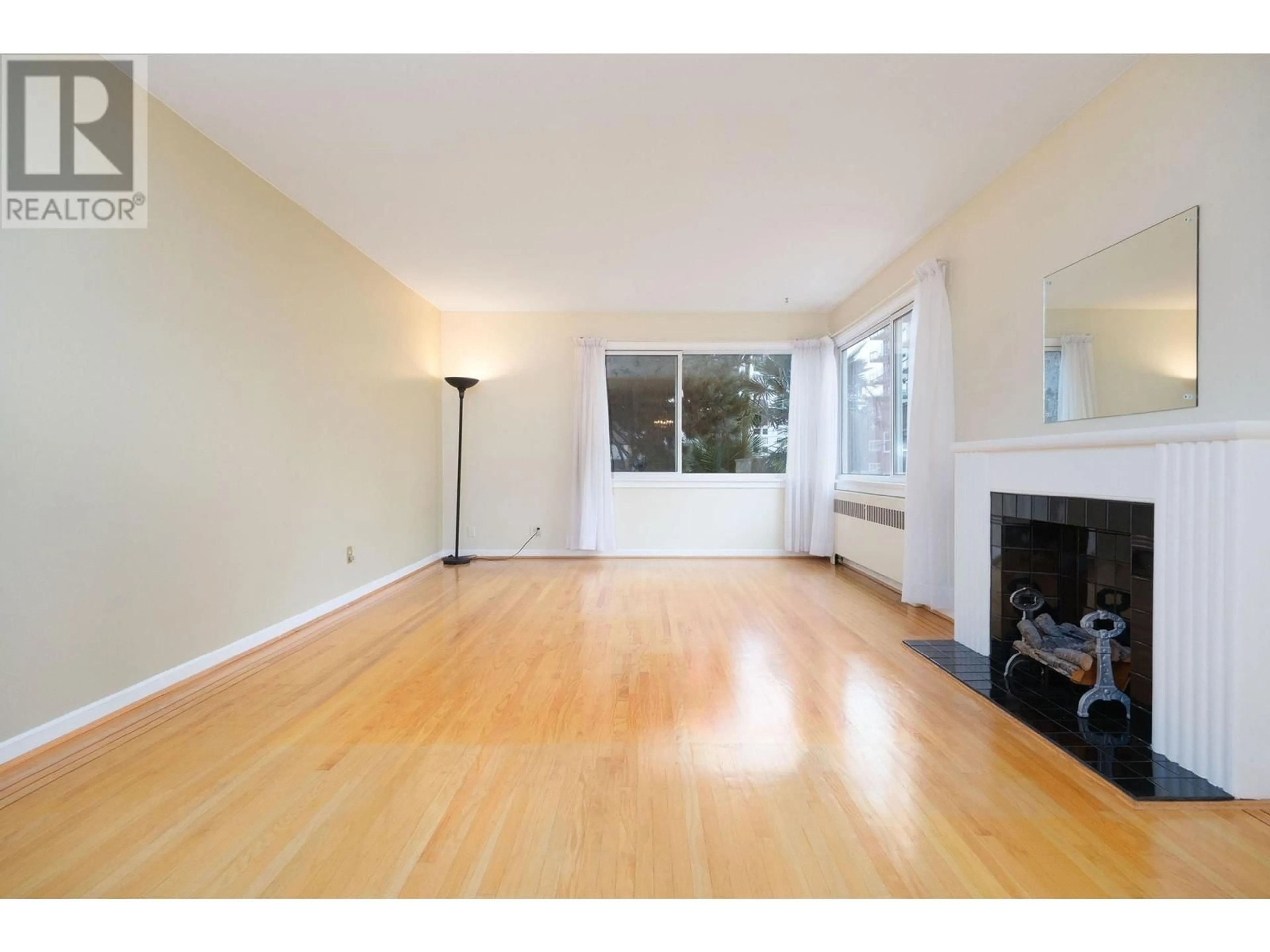 A pic of a room, wood floors for 203 1878 ROBSON STREET, Vancouver British Columbia V6G1E3