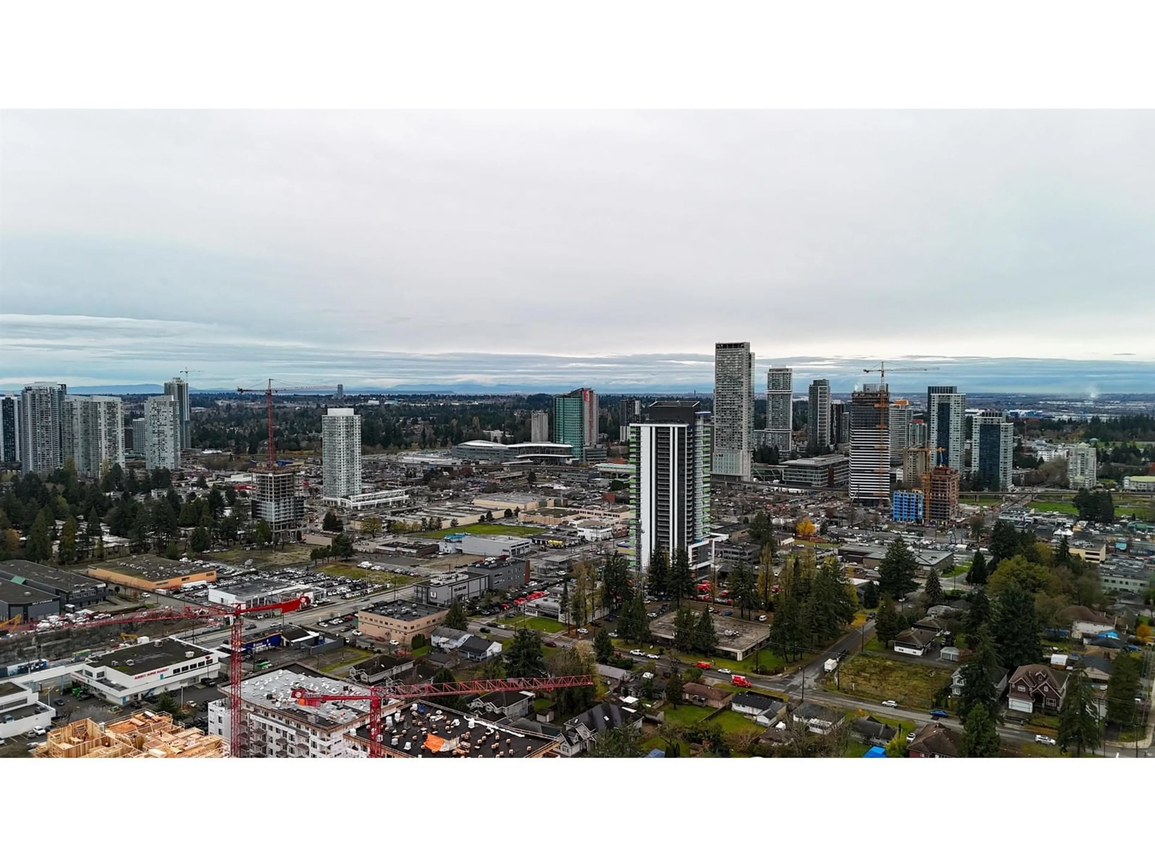 A pic from exterior of the house or condo, the view of city buildings for 202 13933 105 BOULEVARD, Surrey British Columbia V3T0R6