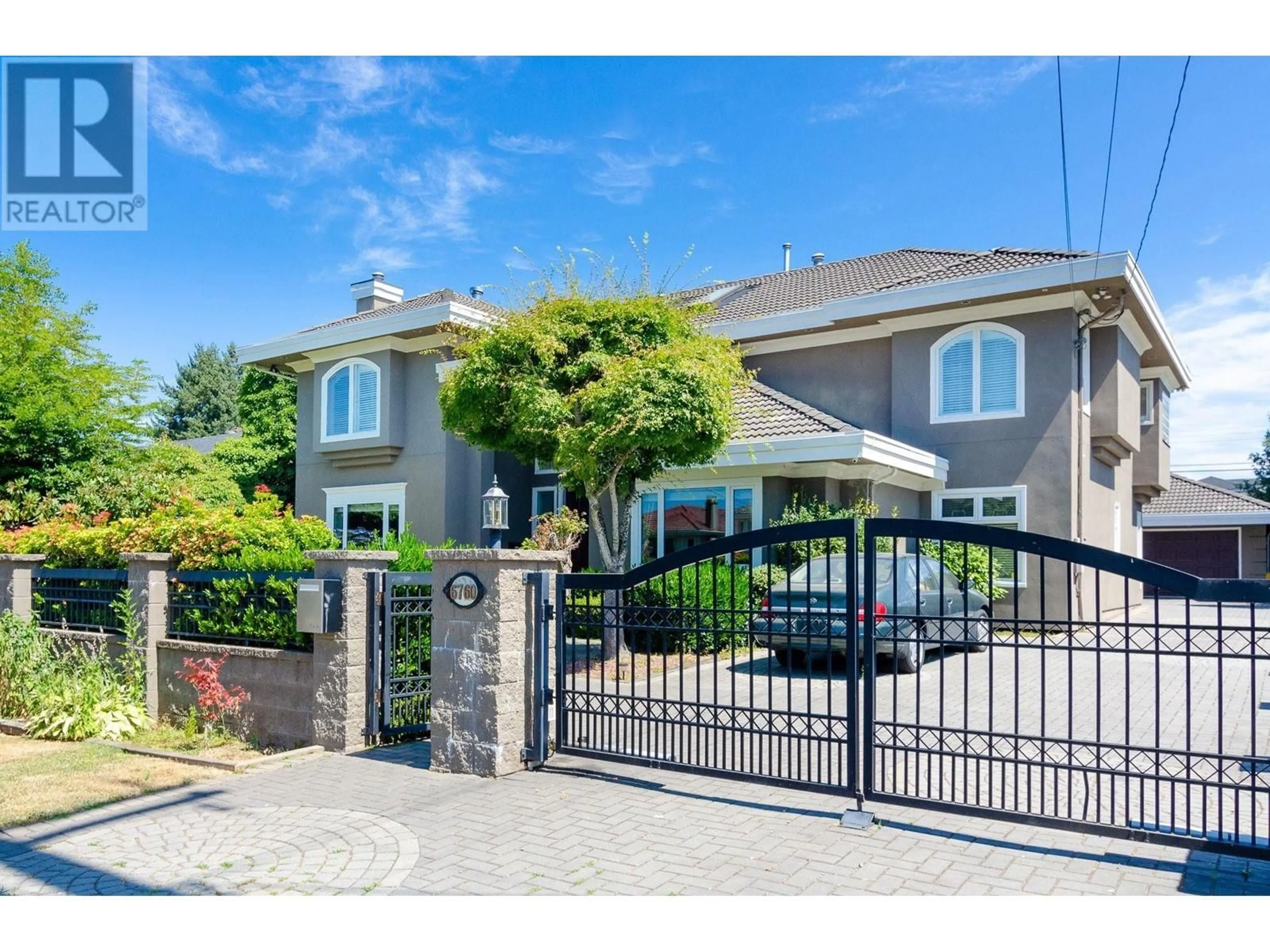 Frontside or backside of a home, the fenced backyard for 6760 BRANTFORD AVENUE, Burnaby British Columbia V5E2S1