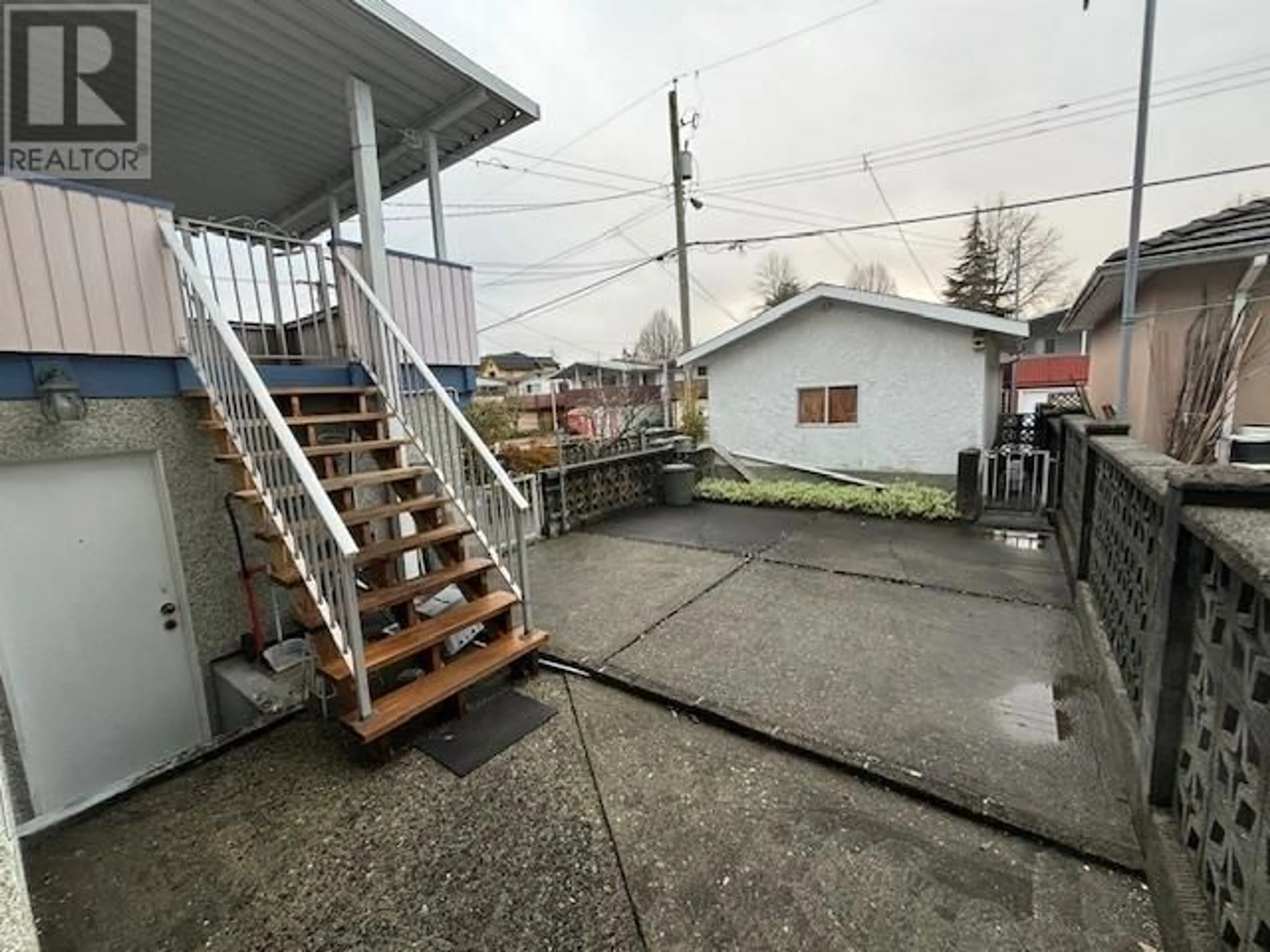 Frontside or backside of a home, the fenced backyard for 2558 E 42ND AVENUE, Vancouver British Columbia V5R2Y1