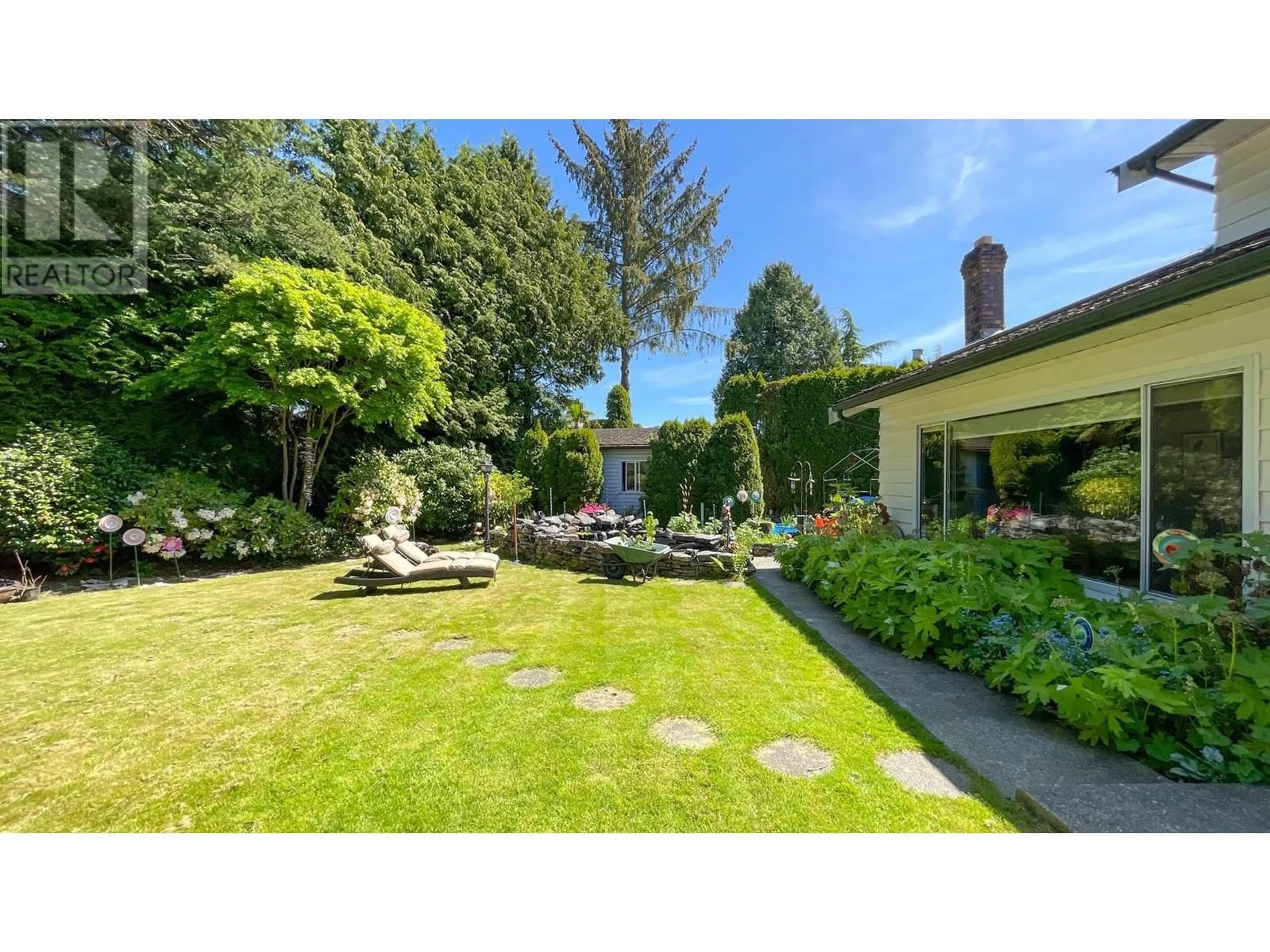 Frontside or backside of a home, the fenced backyard for 7580 WILLOWFIELD DRIVE, Richmond British Columbia V7C4S7