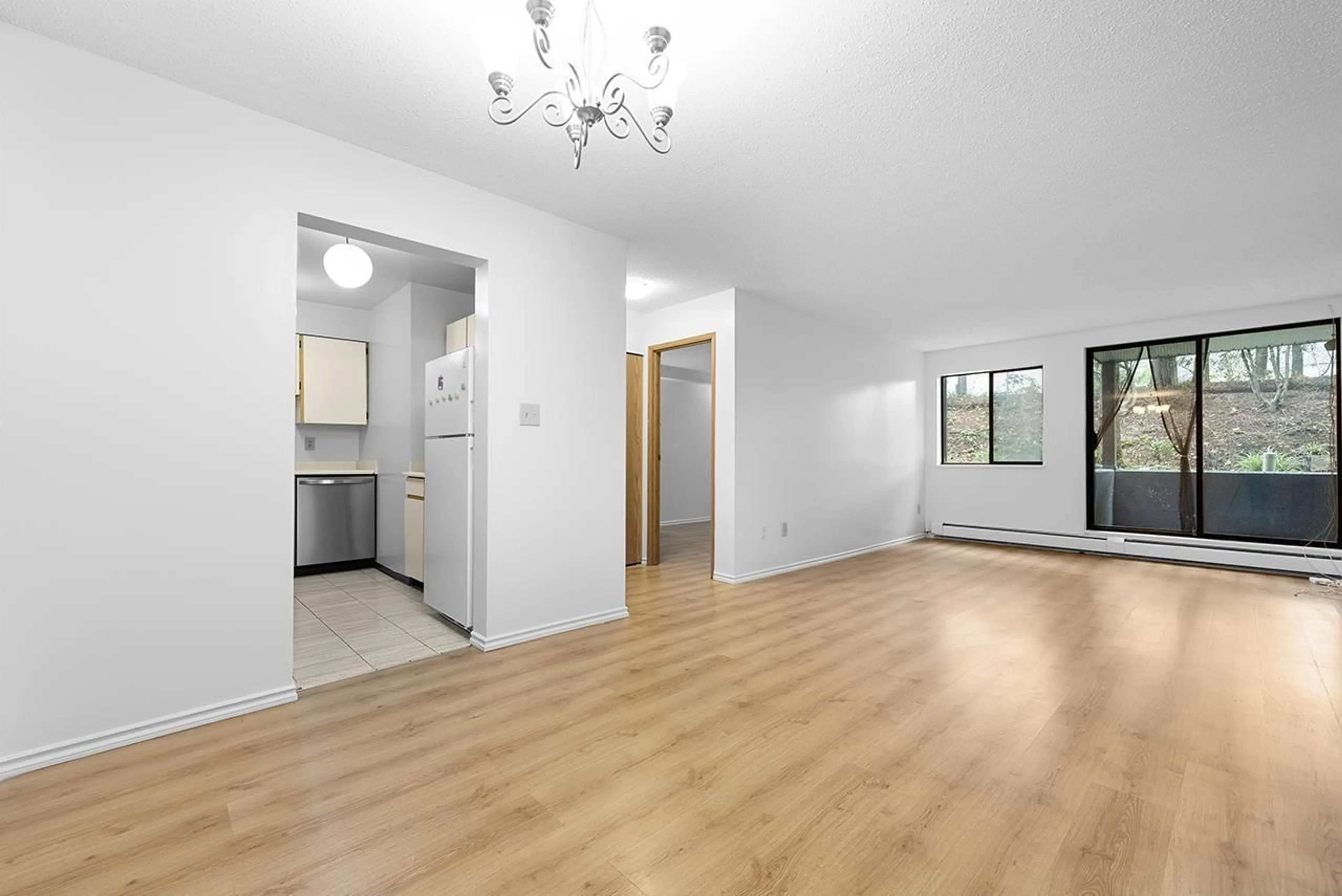 A pic of a room, wood floors for 111 10698 151A STREET, Surrey British Columbia V3R8T5