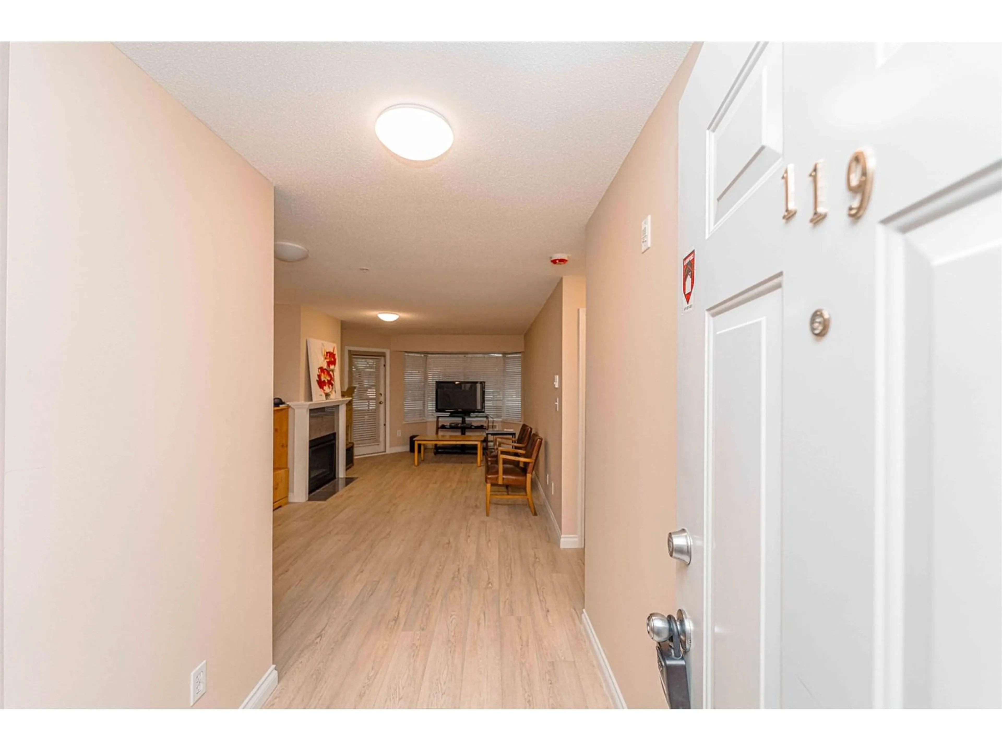 Indoor entryway, wood floors for 119 2962 TRETHEWEY STREET, Abbotsford British Columbia V2T4M3