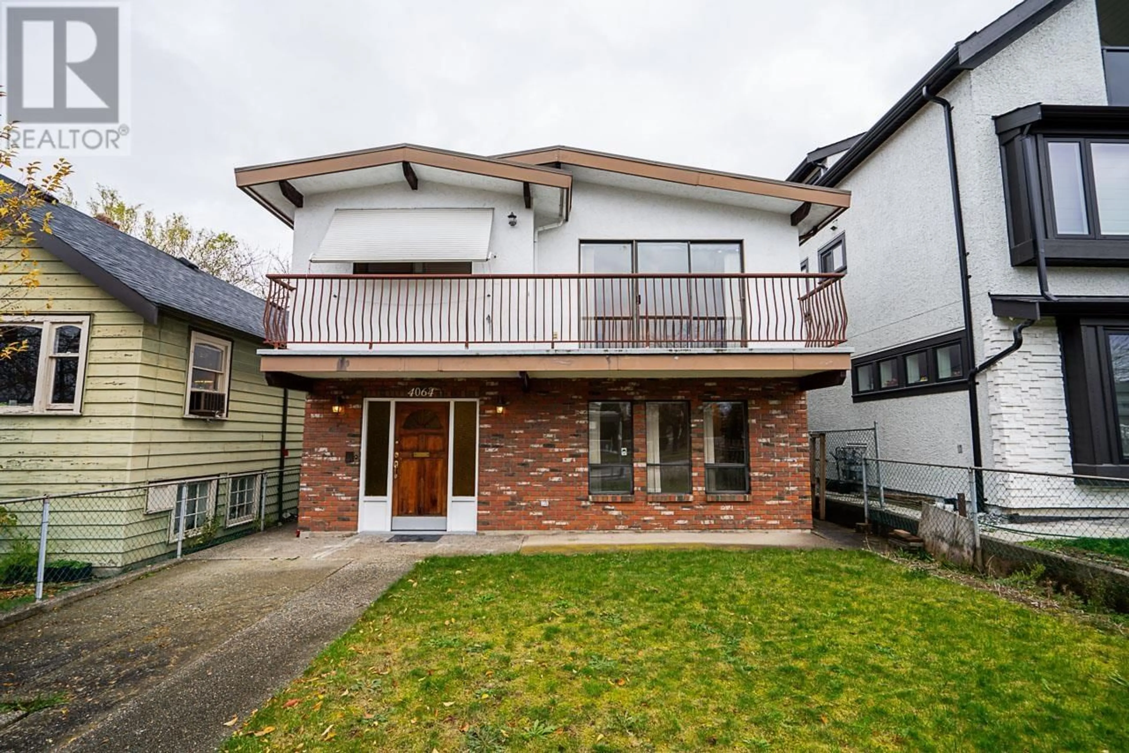 Frontside or backside of a home, the fenced backyard for 4064 RUPERT STREET, Vancouver British Columbia V5R2H3