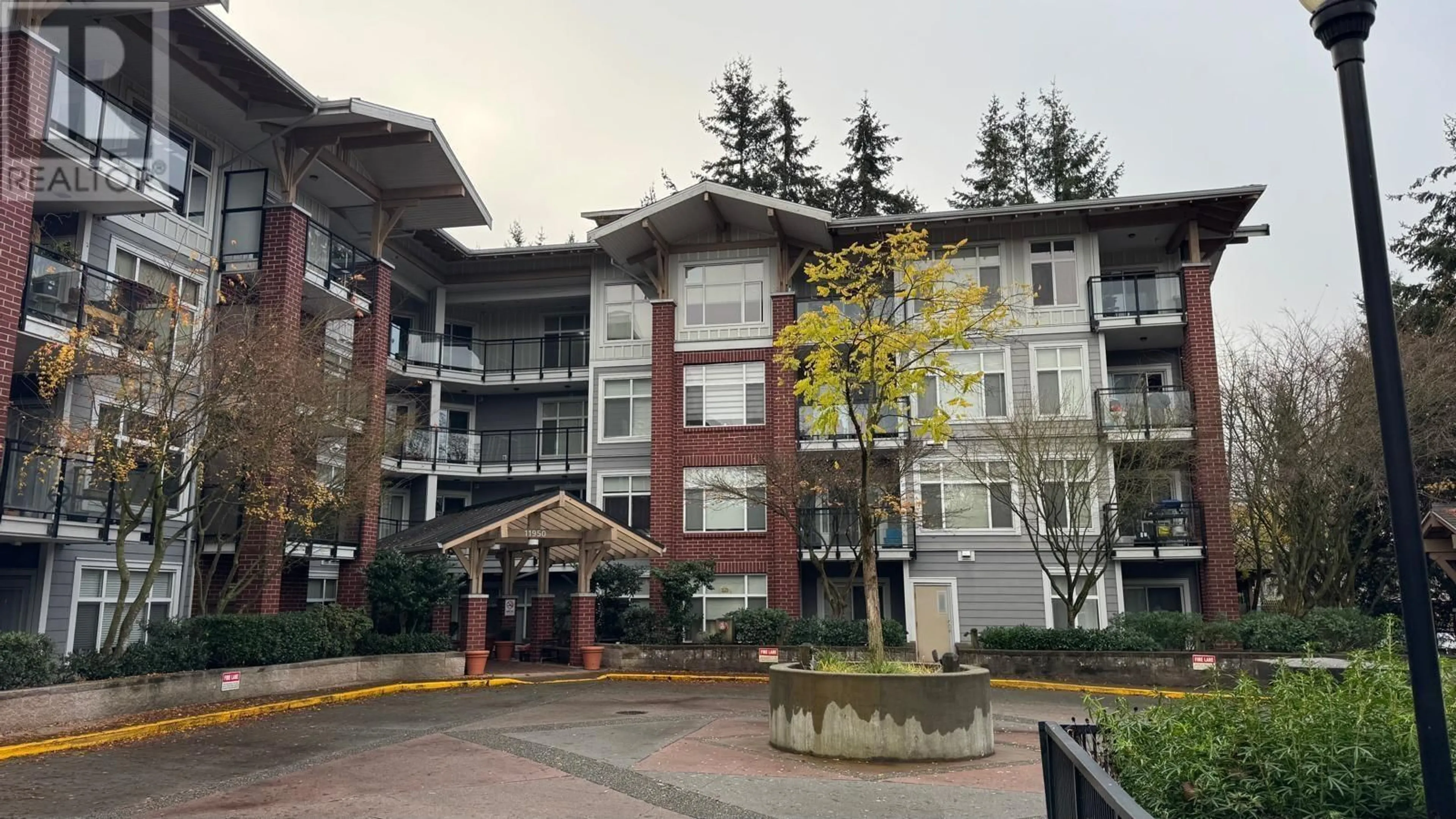 A pic from exterior of the house or condo, the front or back of building for 308 11950 HARRIS ROAD, Pitt Meadows British Columbia V3Y0B7