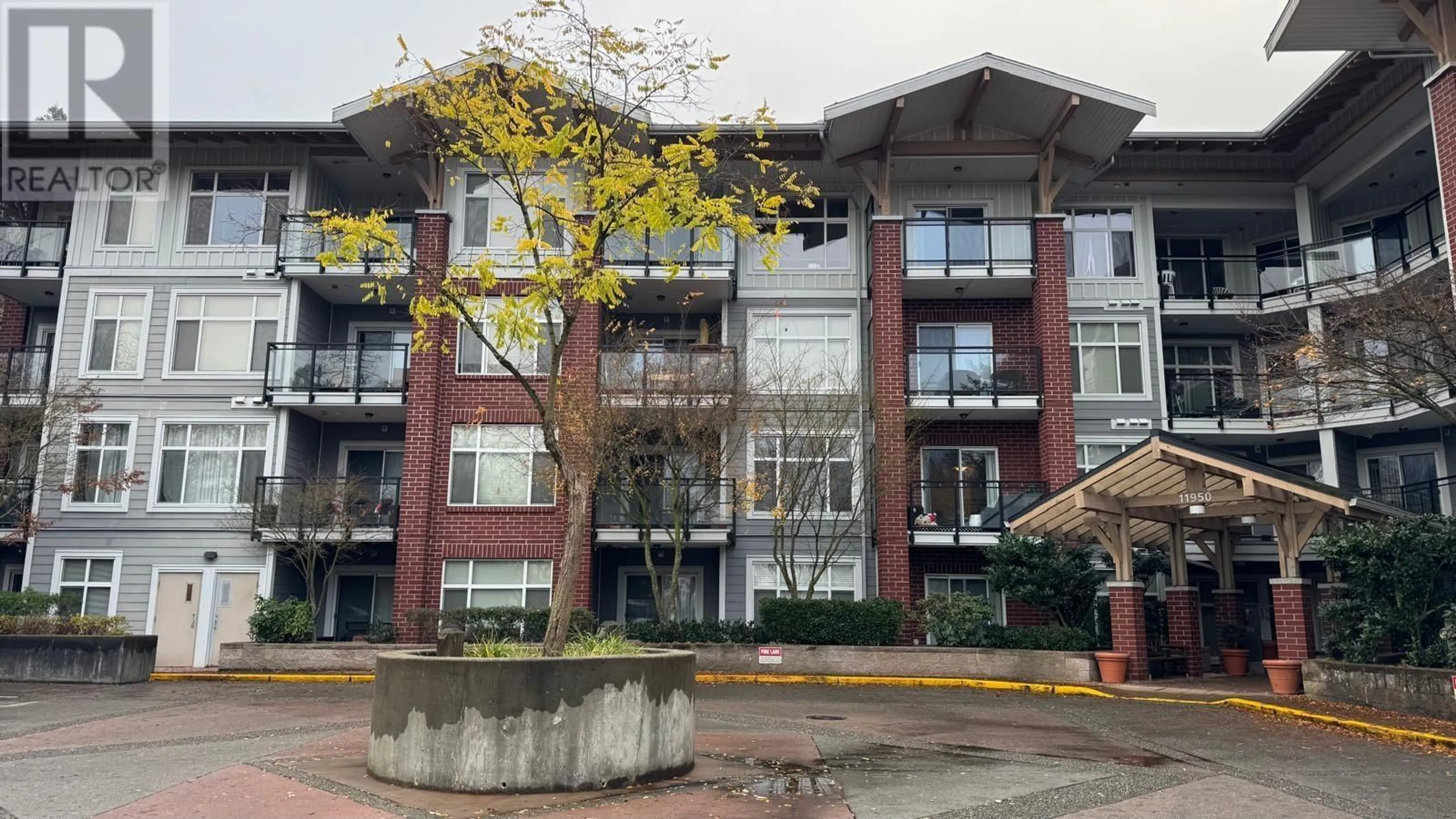 A pic from exterior of the house or condo, the front or back of building for 308 11950 HARRIS ROAD, Pitt Meadows British Columbia V3Y0B7