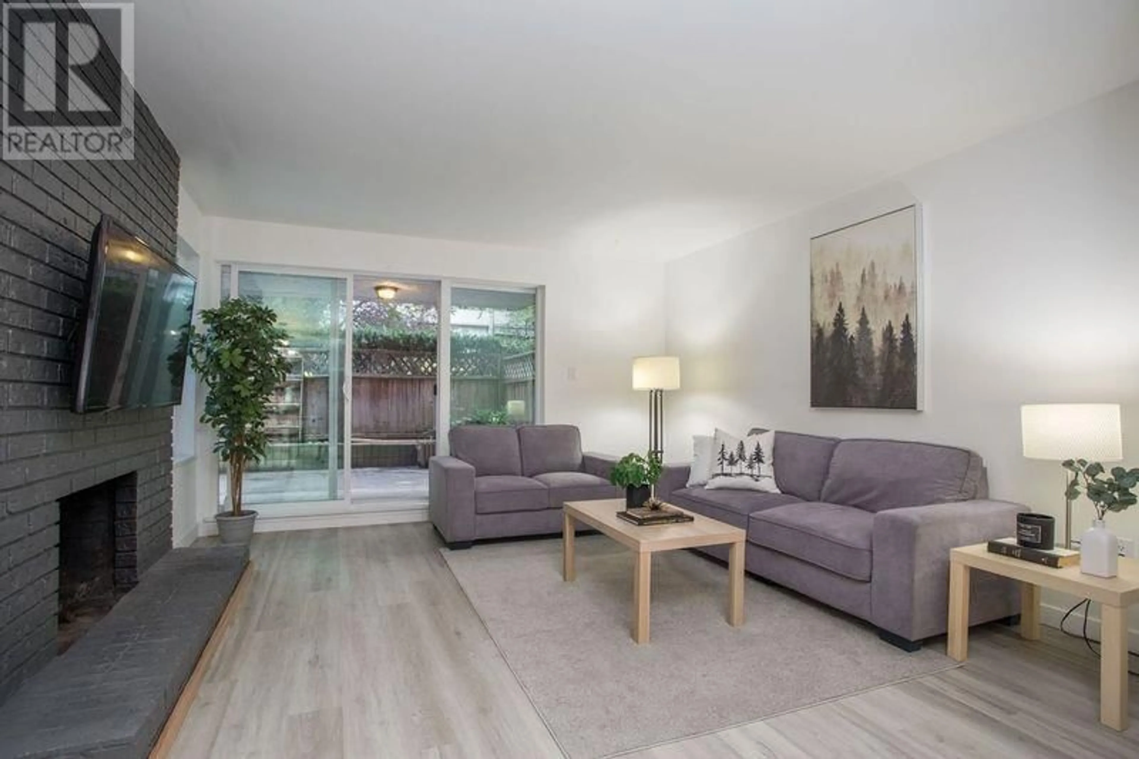 Living room, wood floors for 102 1234 PENDRELL STREET, Vancouver British Columbia V6E1L6