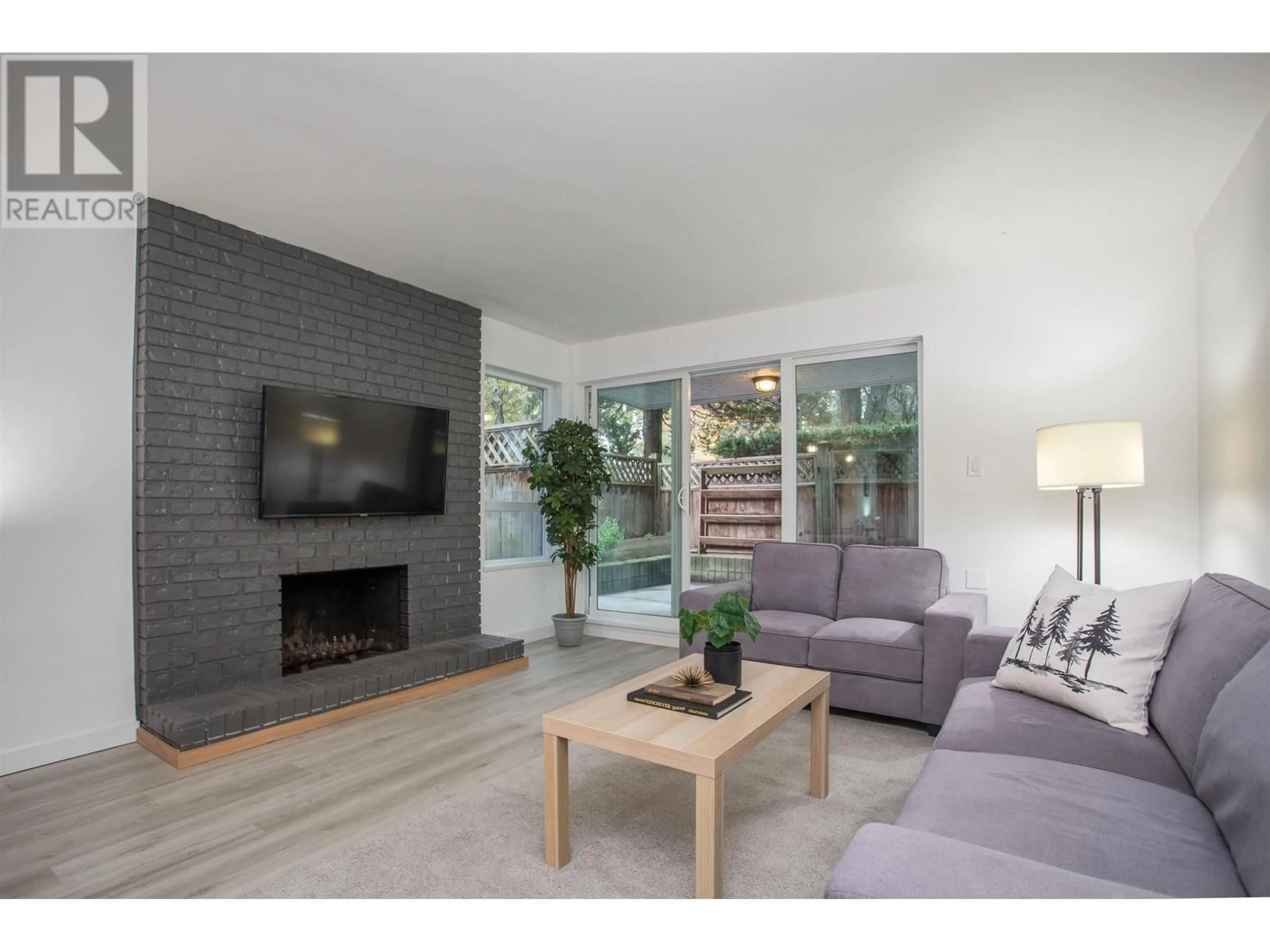 Living room, wood floors for 102 1234 PENDRELL STREET, Vancouver British Columbia V6E1L6